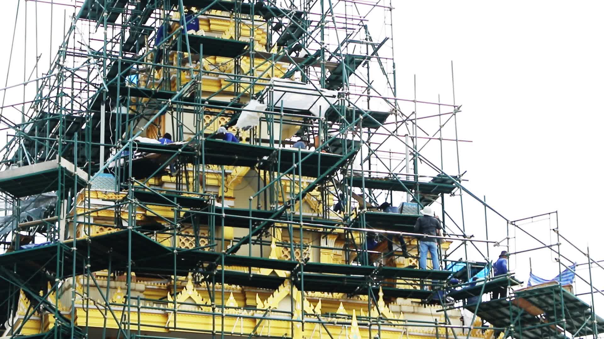Workers work at the royal crematorium under construction at Sanam Luang in Bangkok.