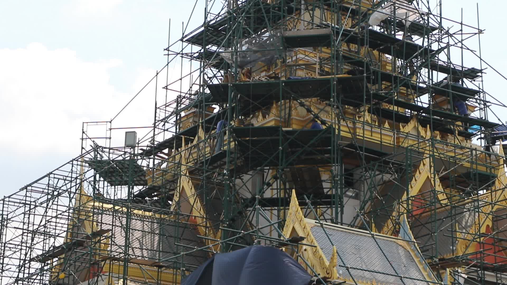 Workers work at the royal crematorium under construction at Sanam Luang in Bangkok.