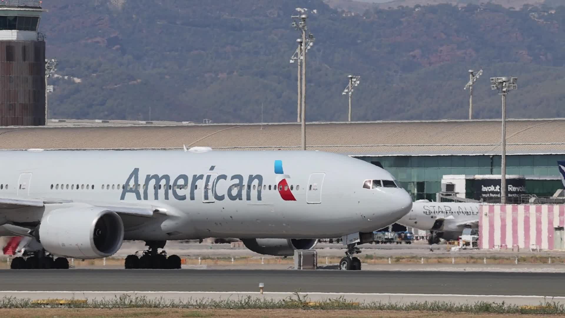 An American Airlines Boeing 777 prepares for takeoff from Barcelona Airport