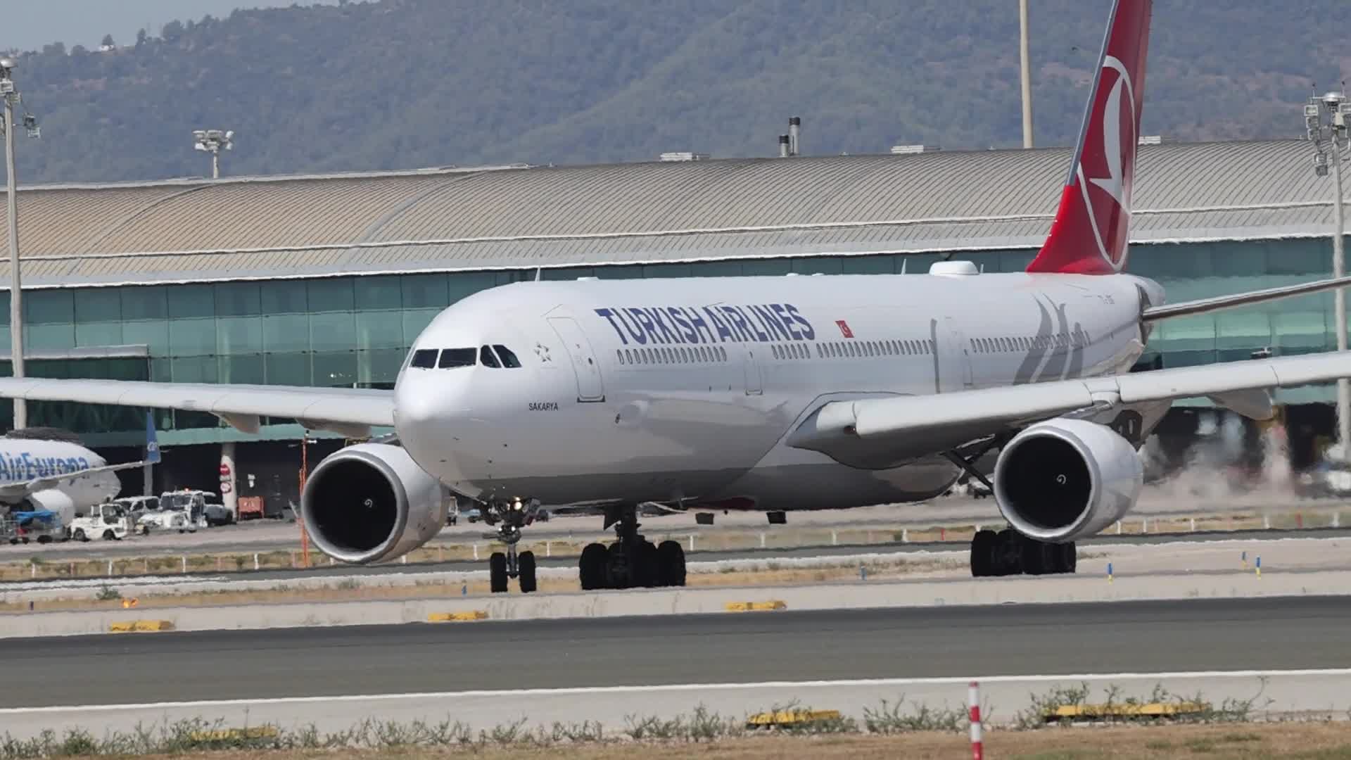 A Turkish Airlines Airbus A330 prepares for takeoff from Barcelona Airport