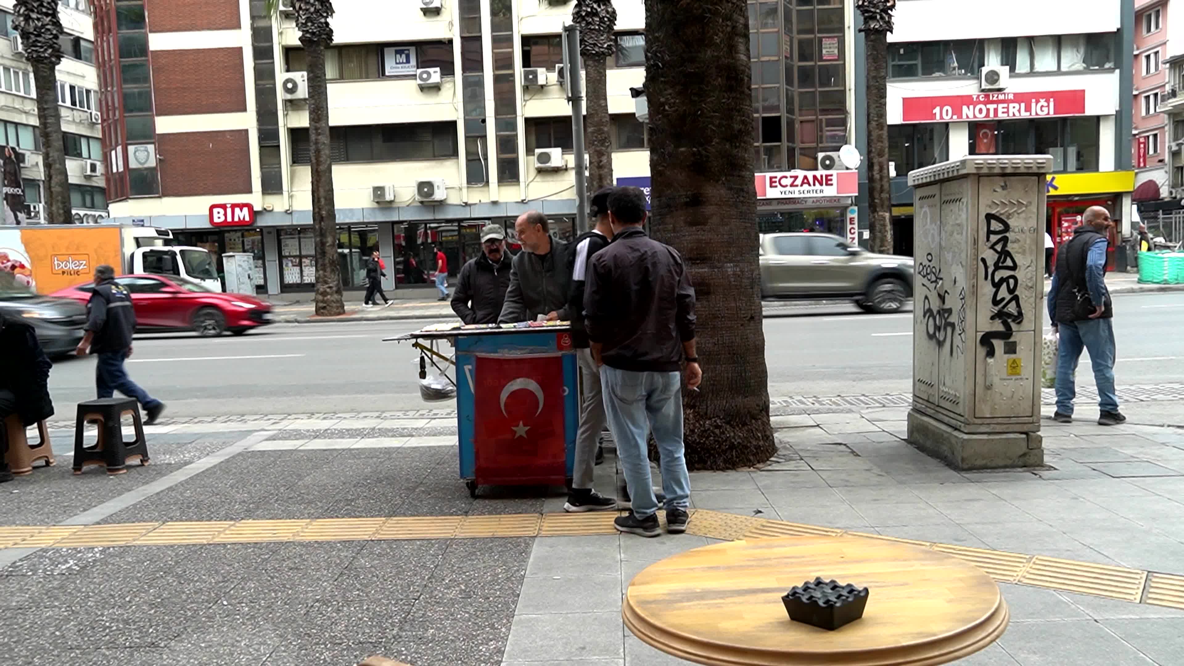 Daily life near of a modern city kiosk in an old street Basmane