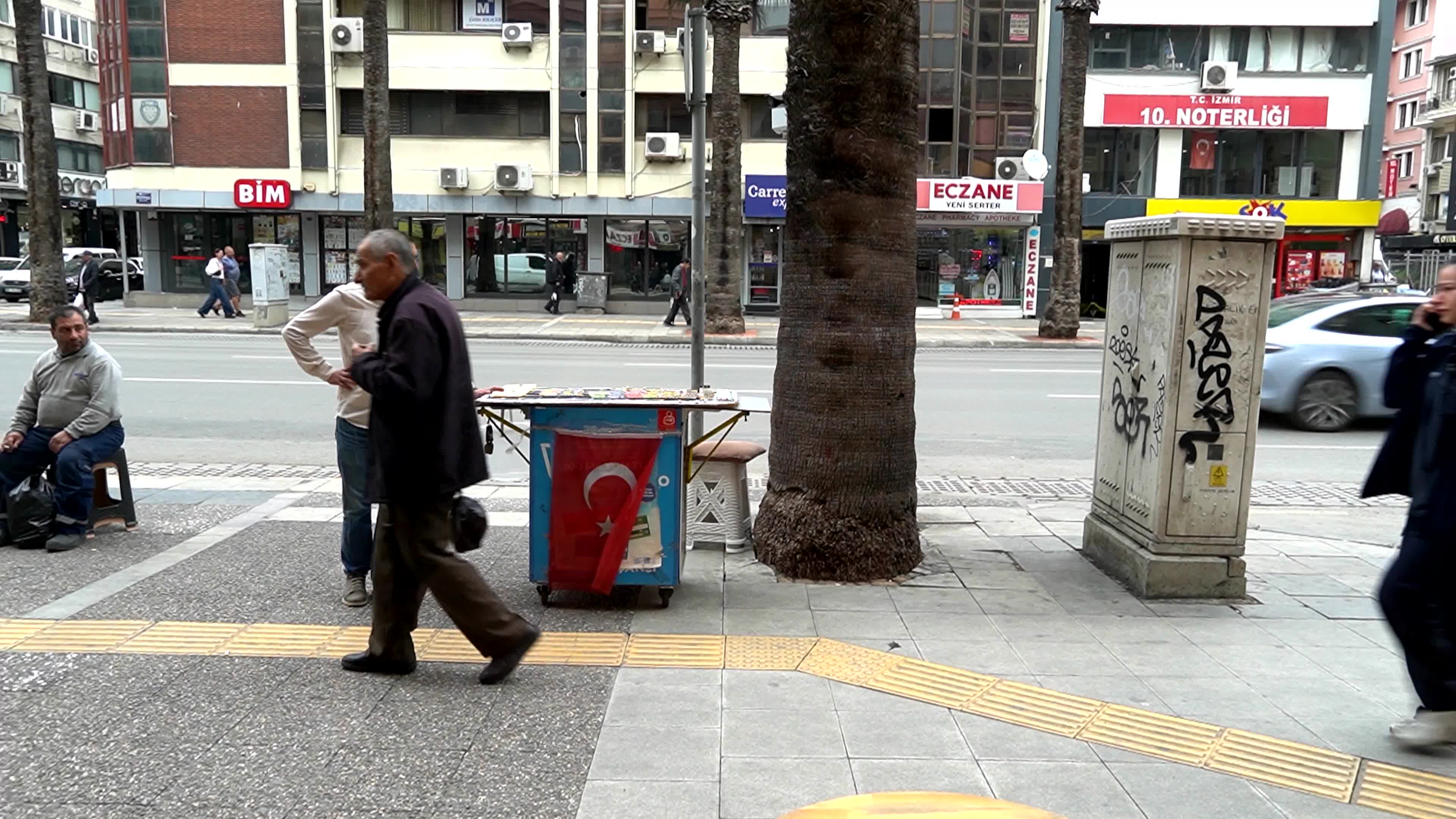 Daily life near of a modern city kiosk in an old street Basmane
