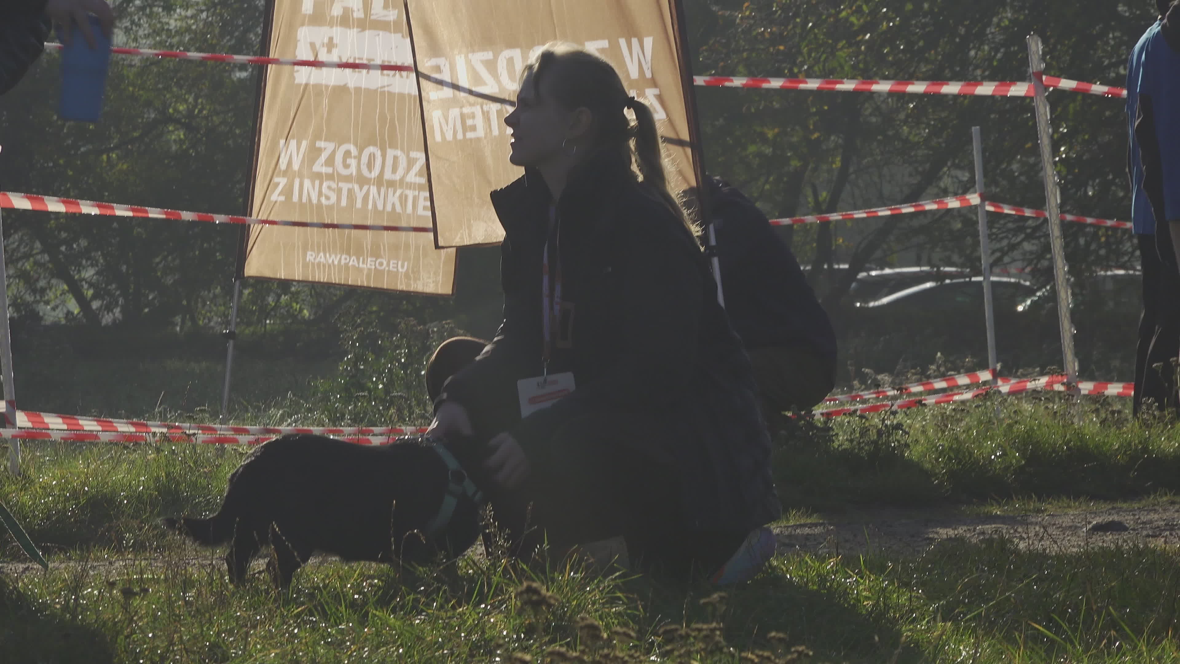 Pet owners run with their dogs in dogtrekking competition in Warsaw
