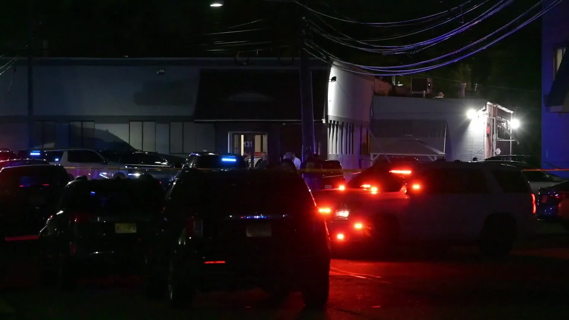 Federal agents work scene of a shooting near Commercial Avenue in Moonachie New Jersey