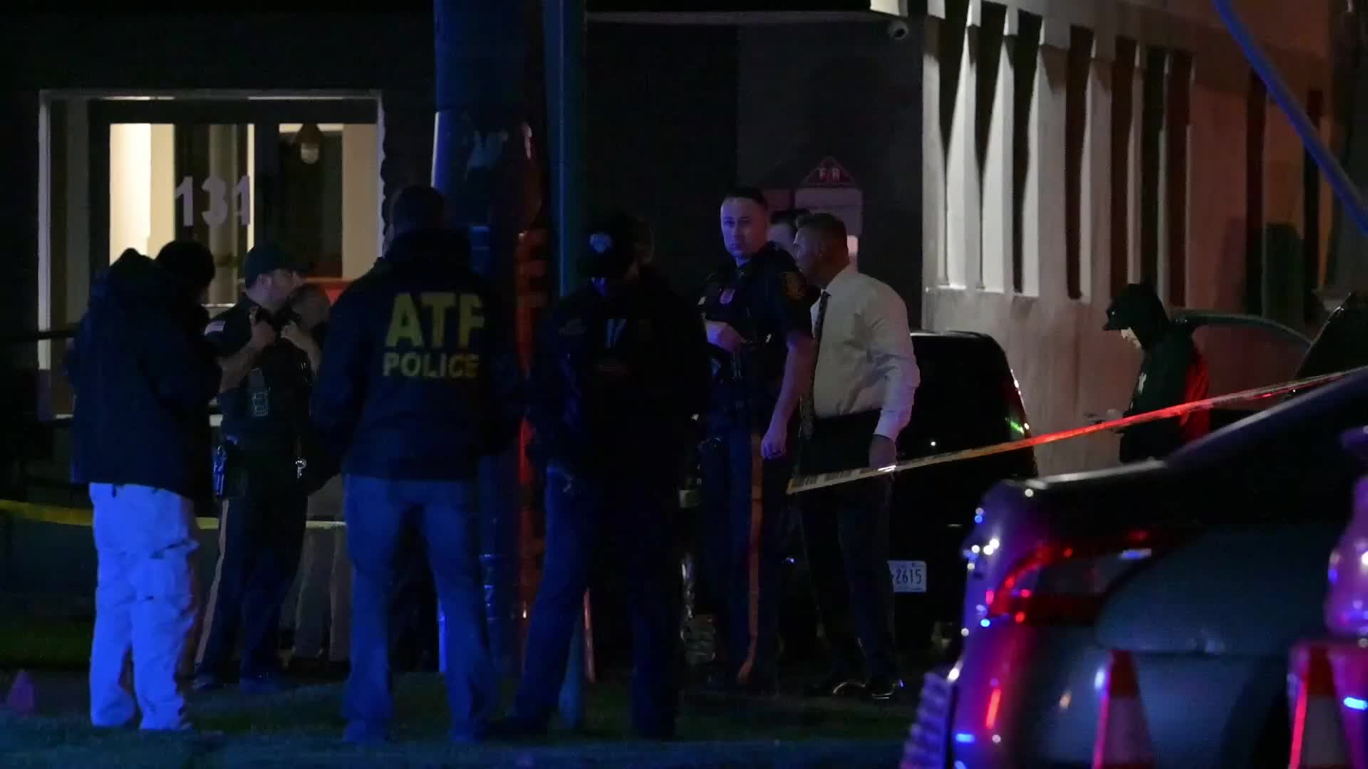 Federal agents work scene of a shooting near Commercial Avenue in Moonachie New Jersey