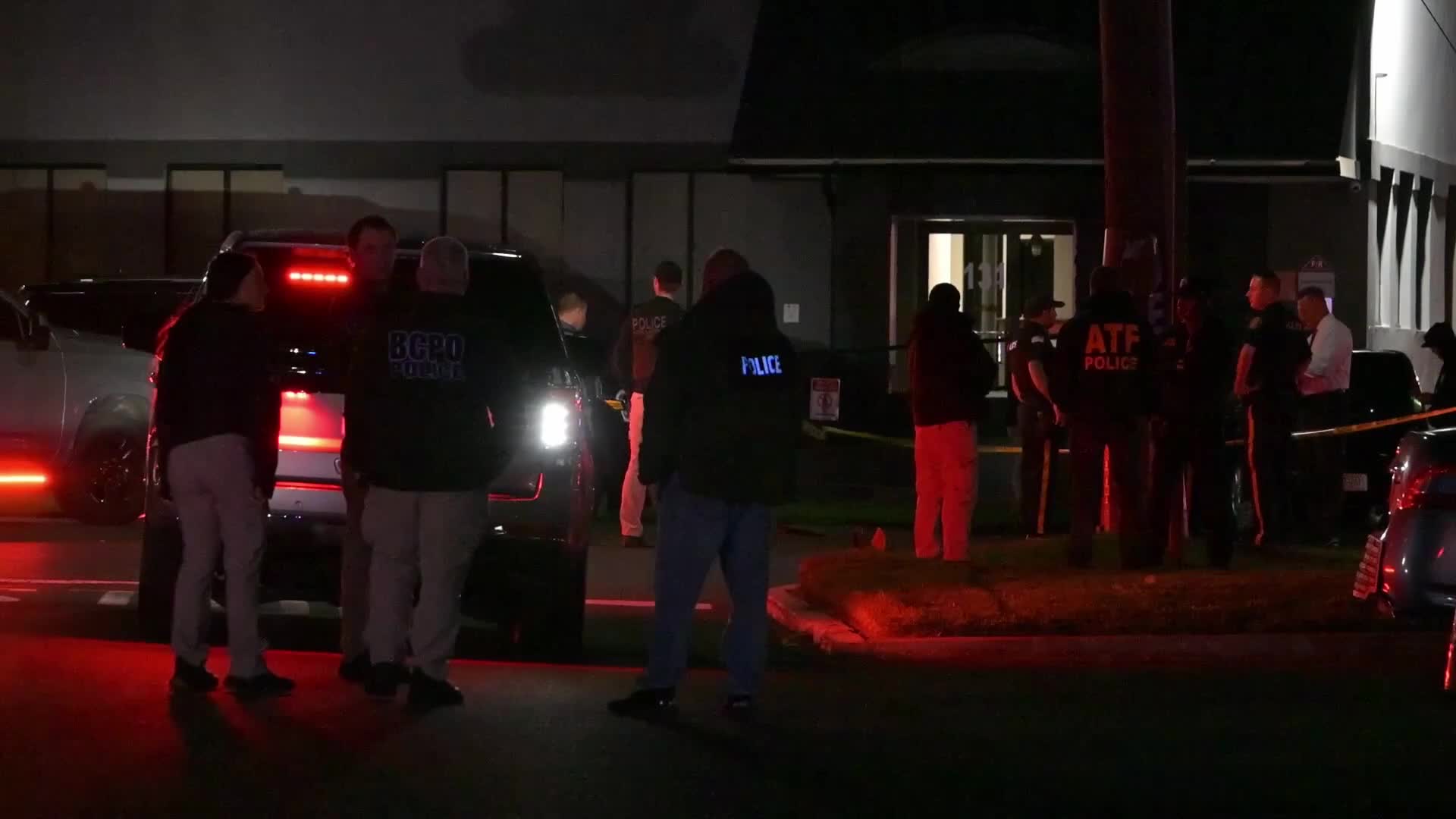 Federal agents work scene of a shooting near Commercial Avenue in Moonachie New Jersey