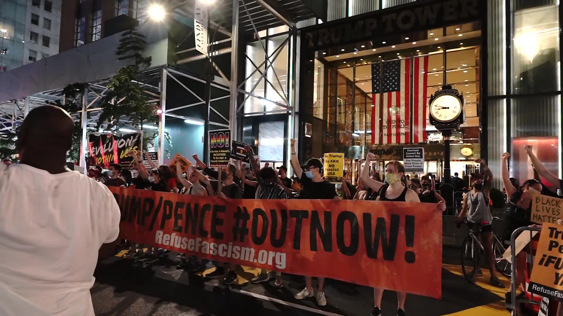 Protestors demand the resignation of President Trump and Vice President Pence as NYC enters Phase 4 of re-opening