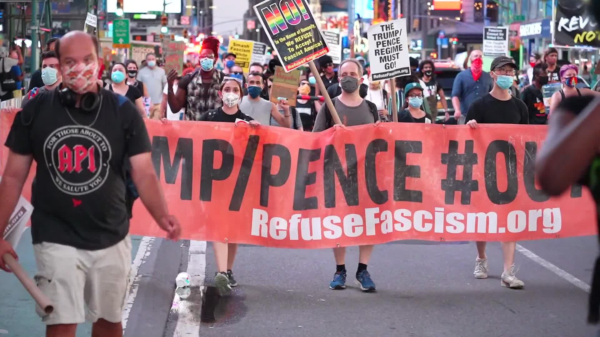 Protestors demand the resignation of President Trump and Vice President Pence as NYC enters Phase 4 of re-opening