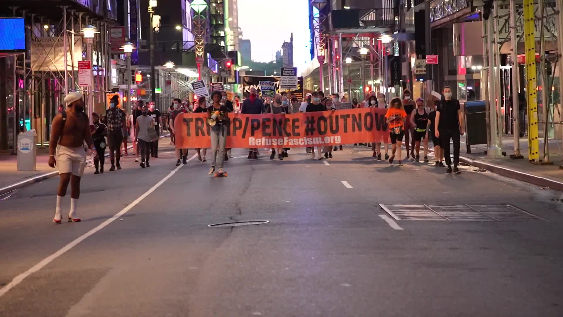 Protestors demand the resignation of President Trump and Vice President Pence as NYC enters Phase 4 of re-opening