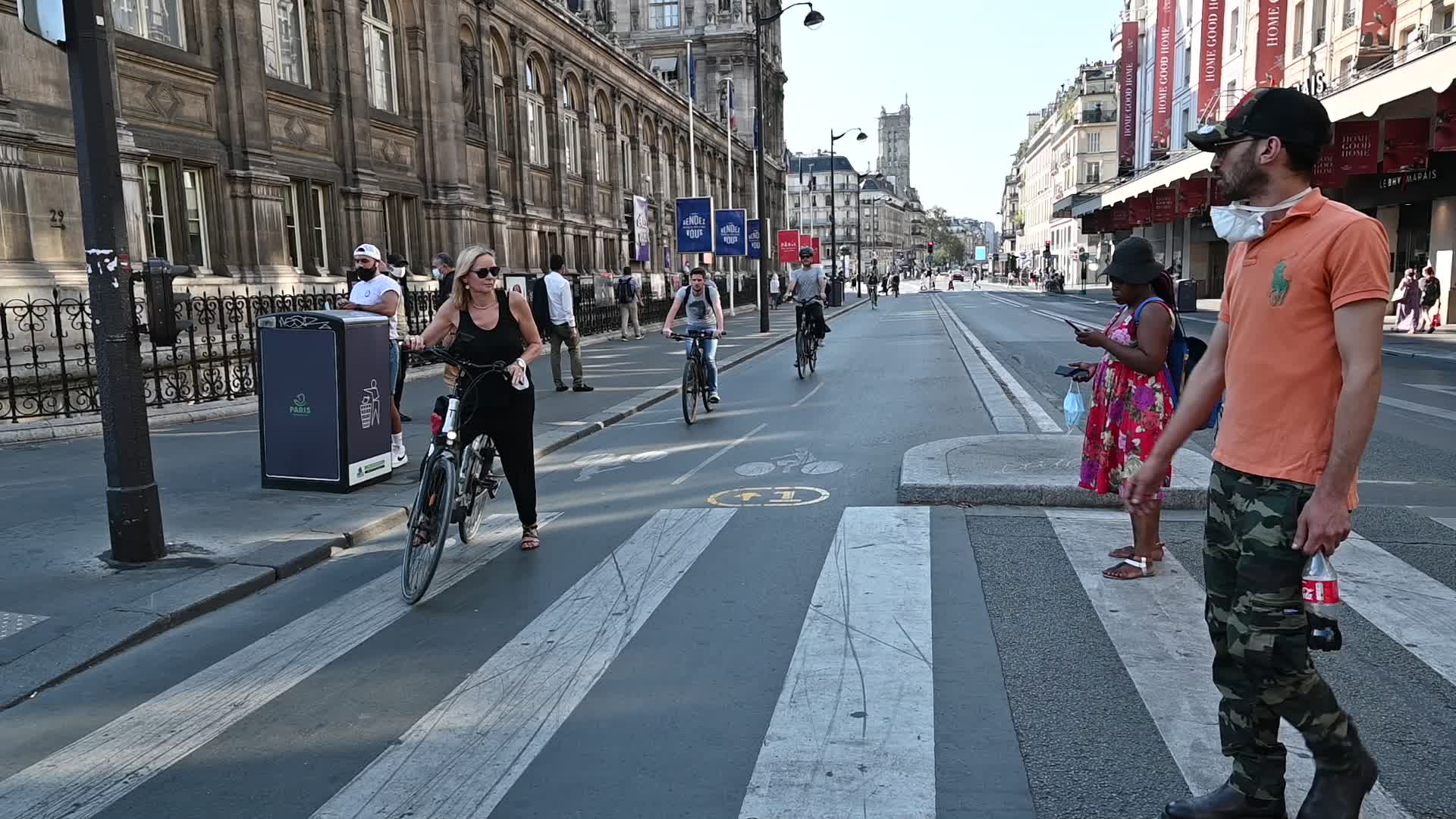 Parisians and commuters cyclists rides in Paris on Rue de Rivoli 