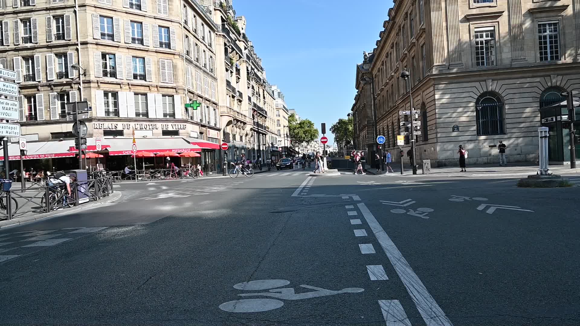 Parisians and commuters cyclists rides in Paris on Rue de Rivoli 