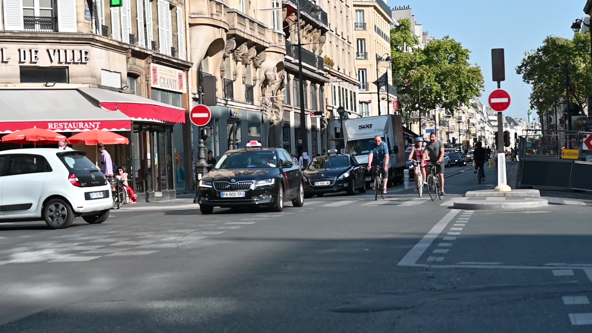 Parisians and commuters cyclists rides in Paris on Rue de Rivoli 