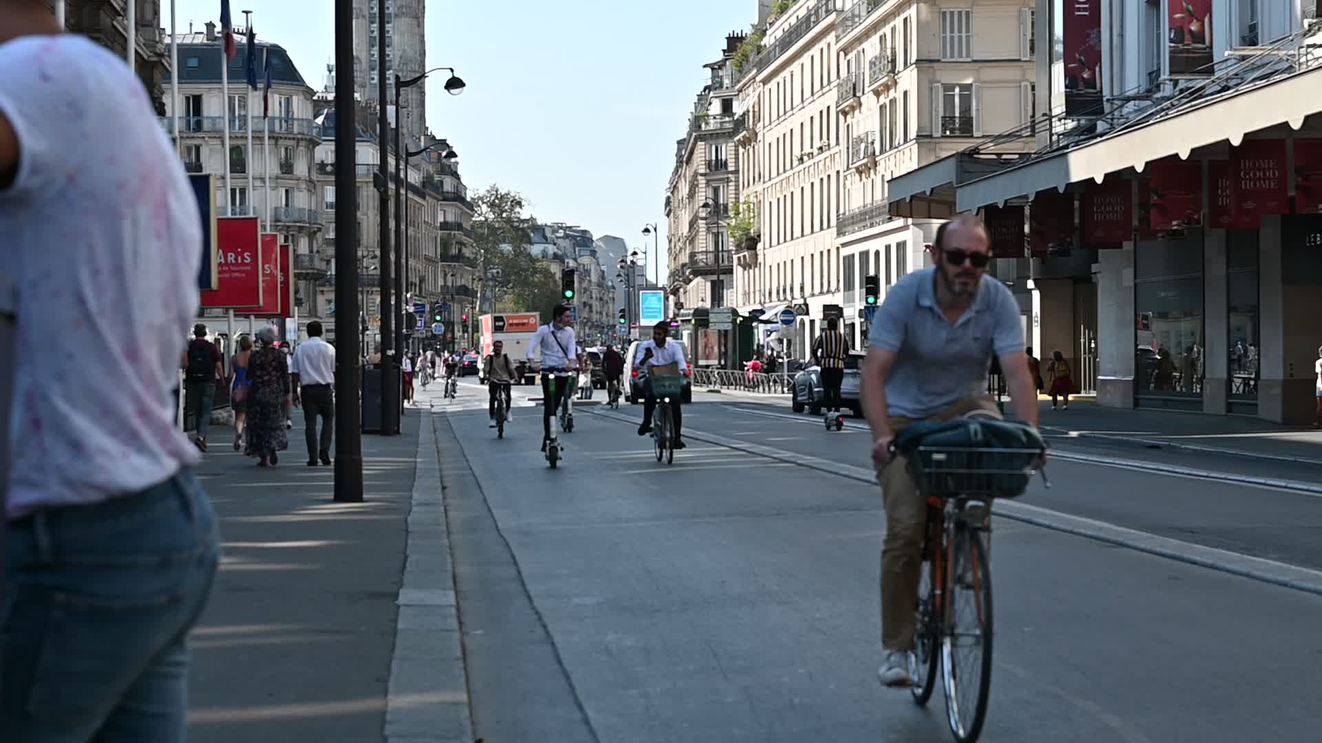 Parisians and commuters cyclists rides in Paris on Rue de Rivoli 