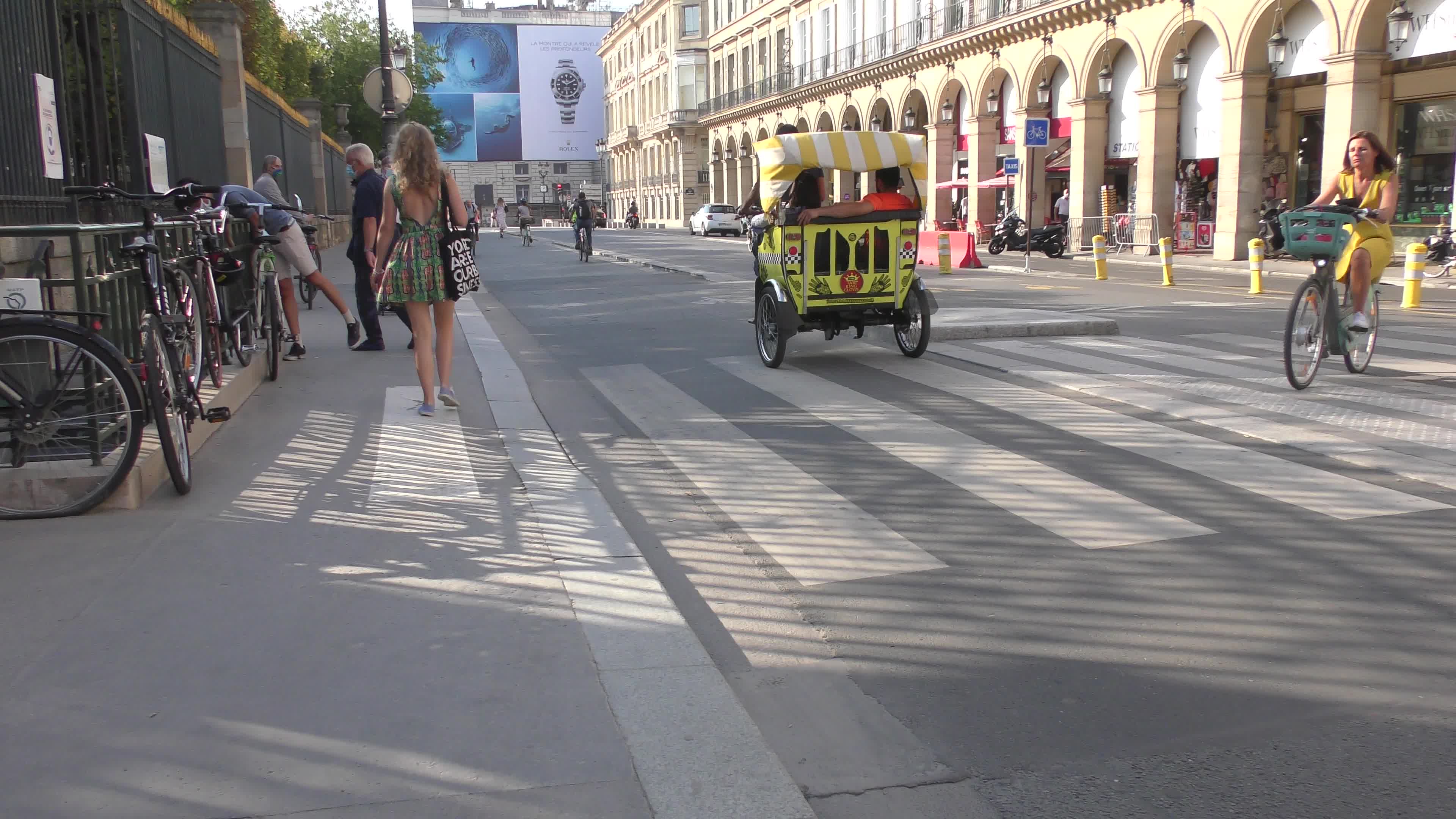 Parisians and commuters cyclists rides in Paris on Rue de Rivoli 
