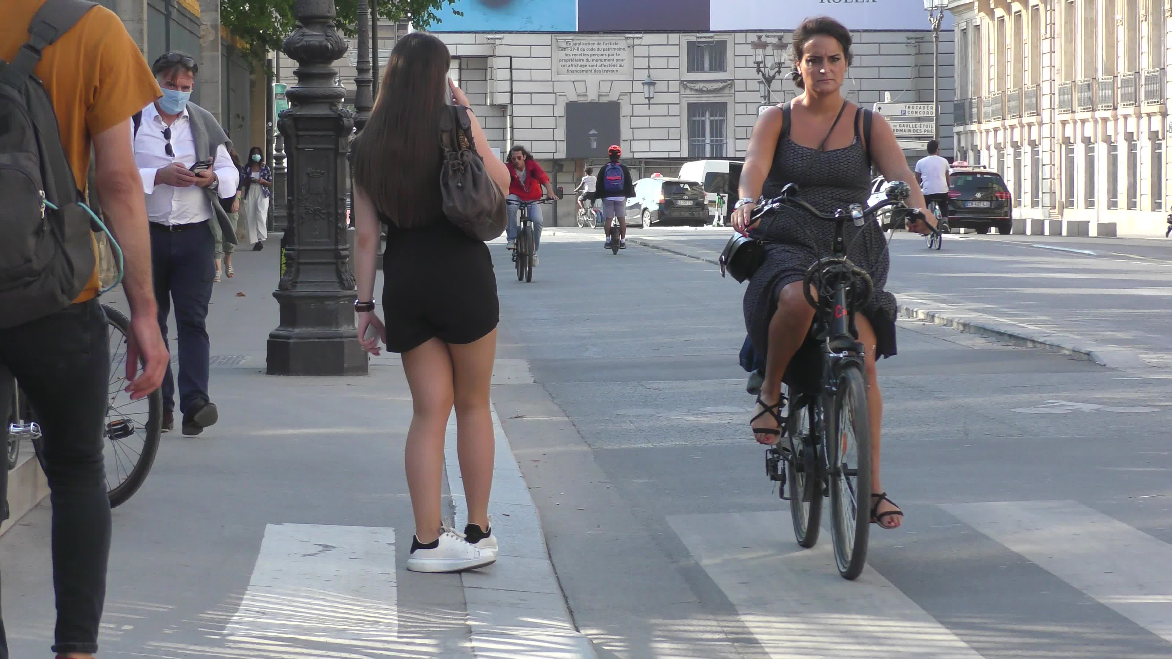 Parisians and commuters cyclists rides in Paris on Rue de Rivoli 