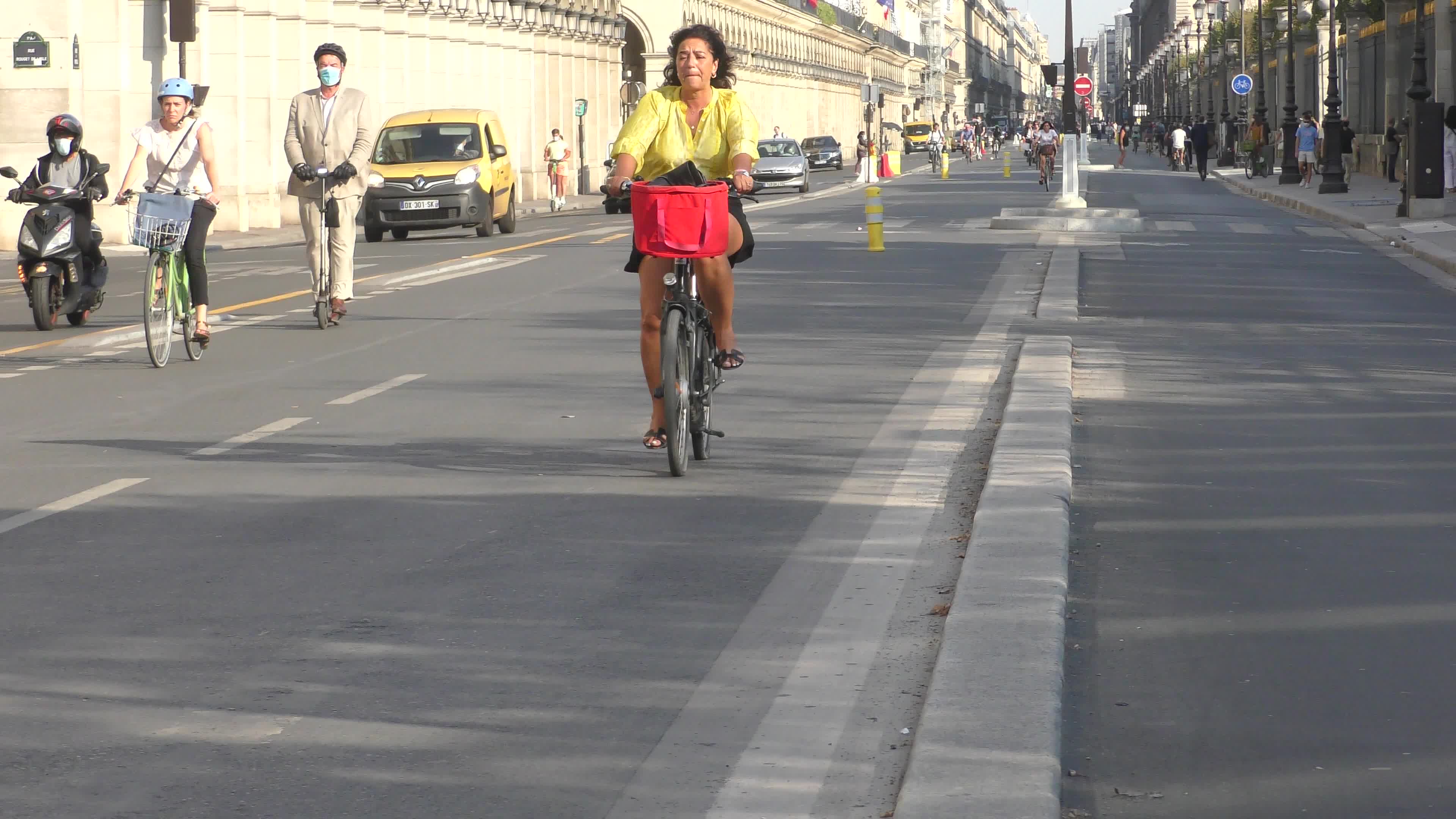 Parisians and commuters cyclists rides in Paris on Rue de Rivoli 