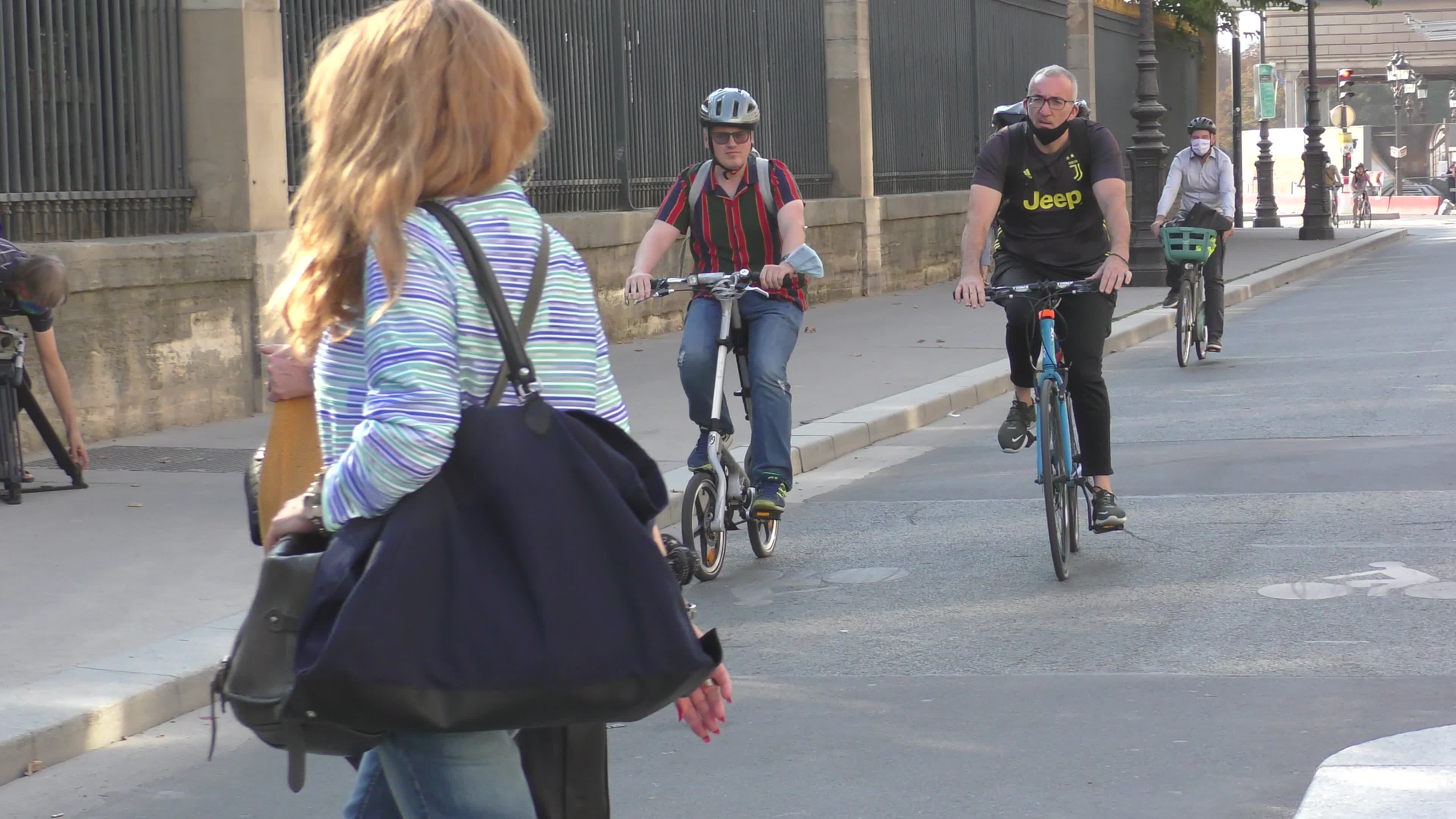 Parisians and commuters cyclists rides in Paris on Rue de Rivoli 