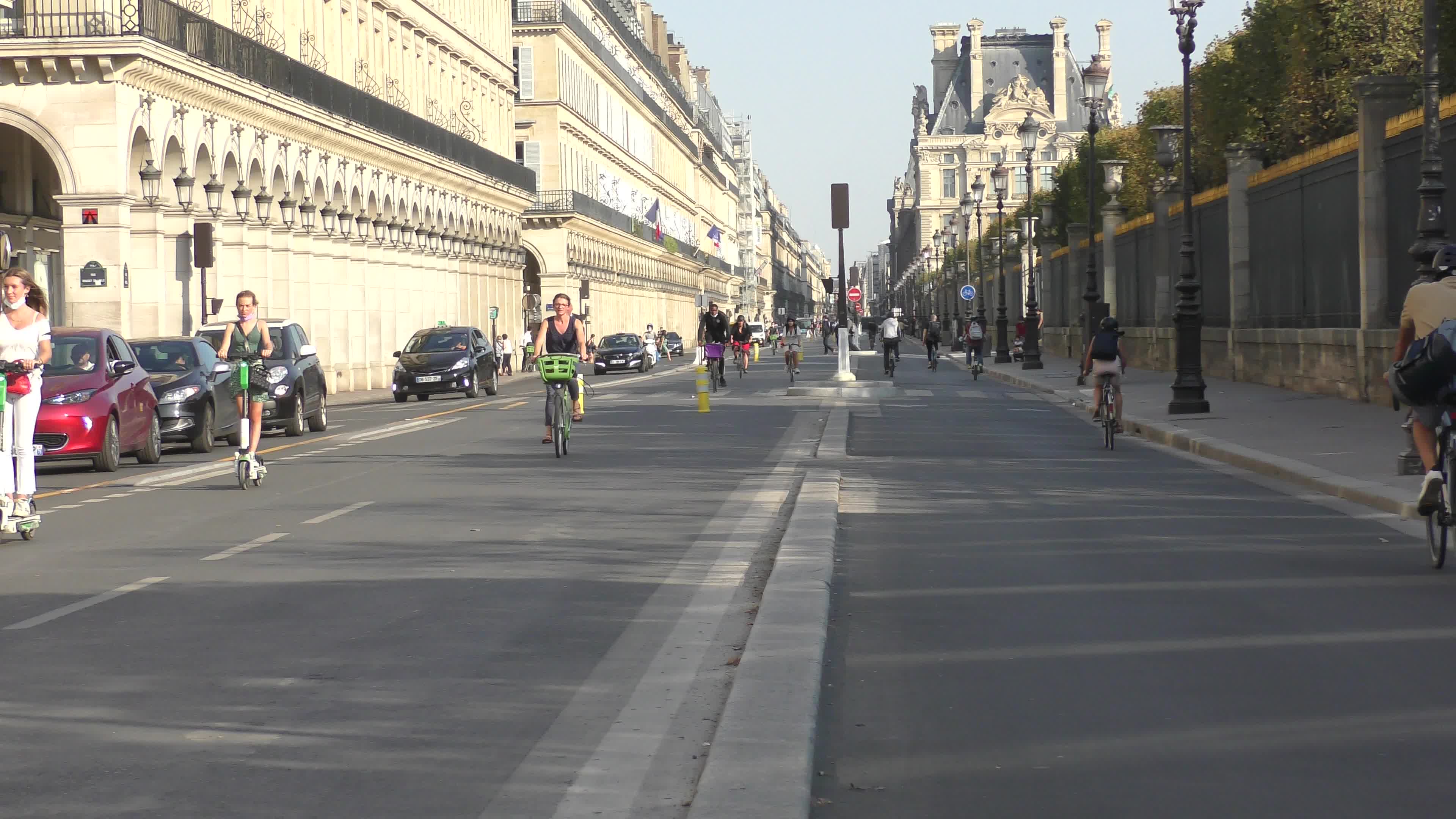 Parisians and commuters cyclists rides in Paris on Rue de Rivoli 