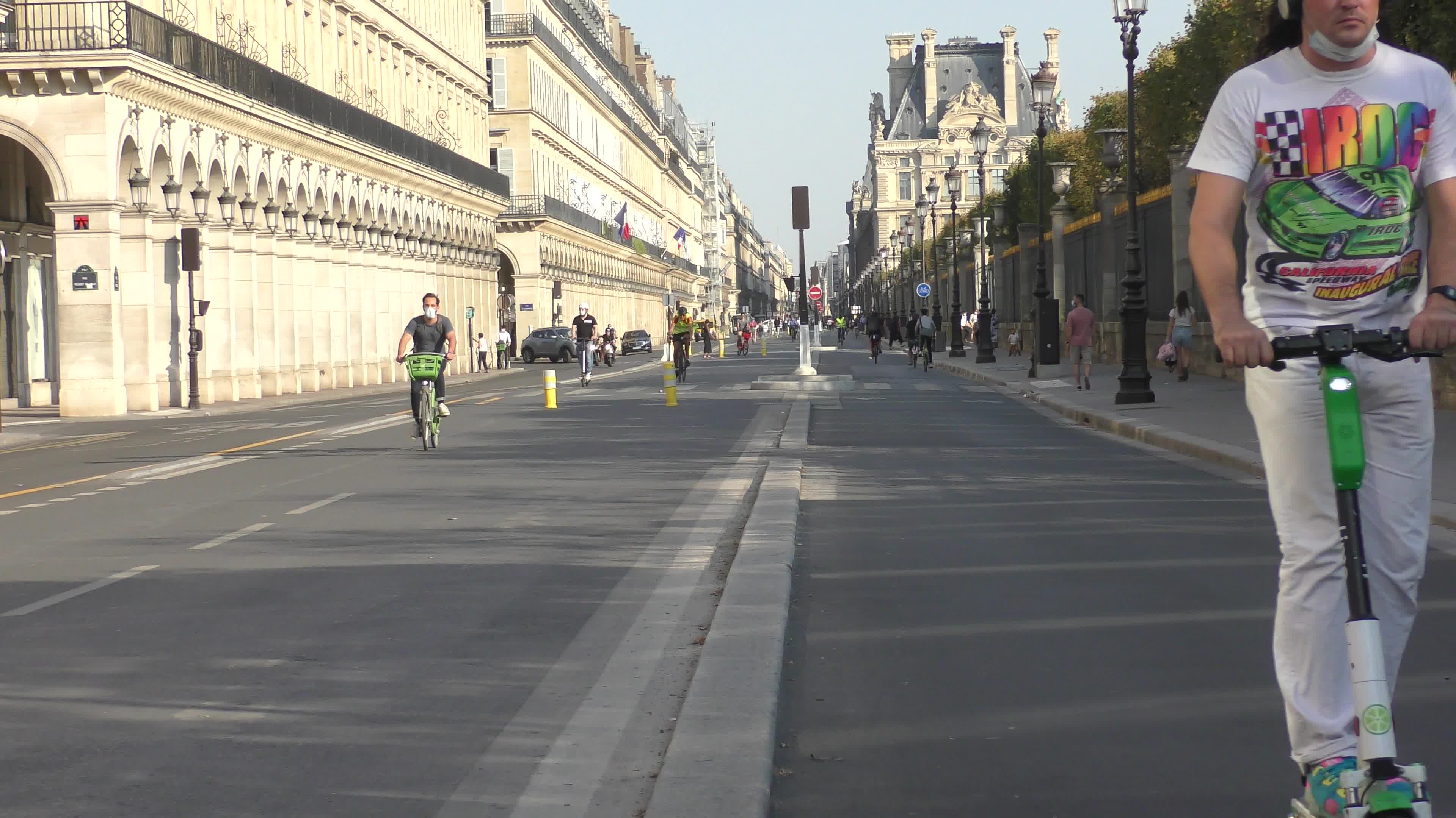 Parisians and commuters cyclists rides in Paris on Rue de Rivoli 