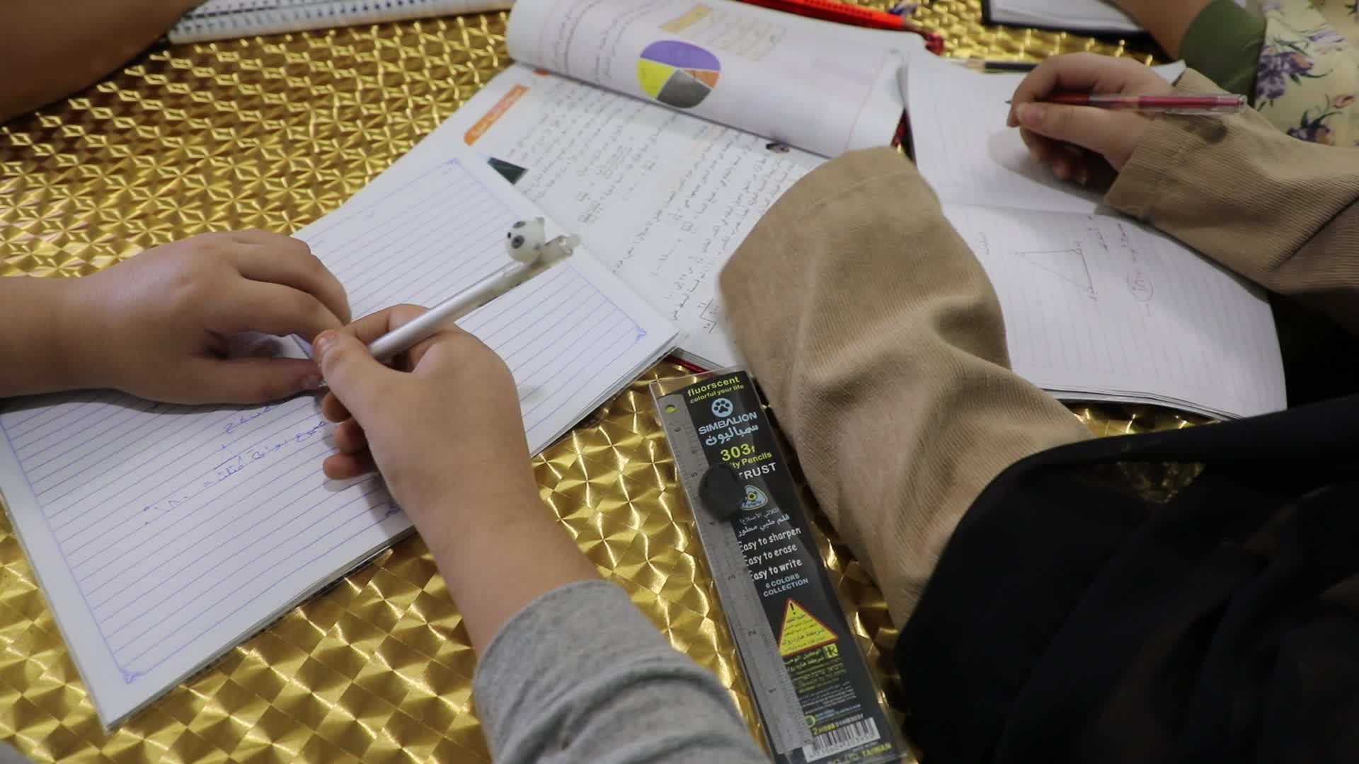 80-year teacher teach to students amid the COVID-19 pandemic in Gaza