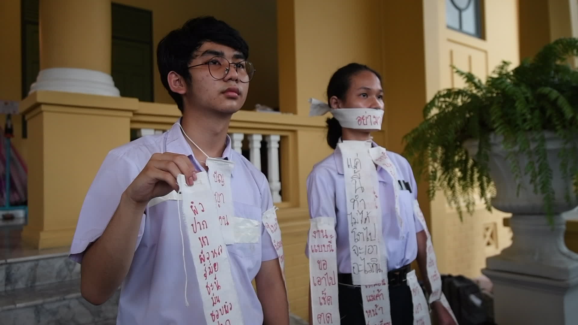 Thai students and teachers light candles against violence in schools