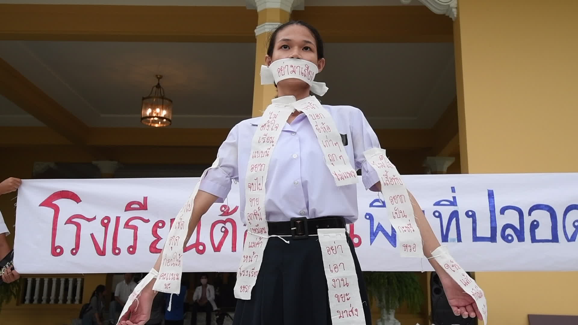 Thai students and teachers light candles against violence in schools
