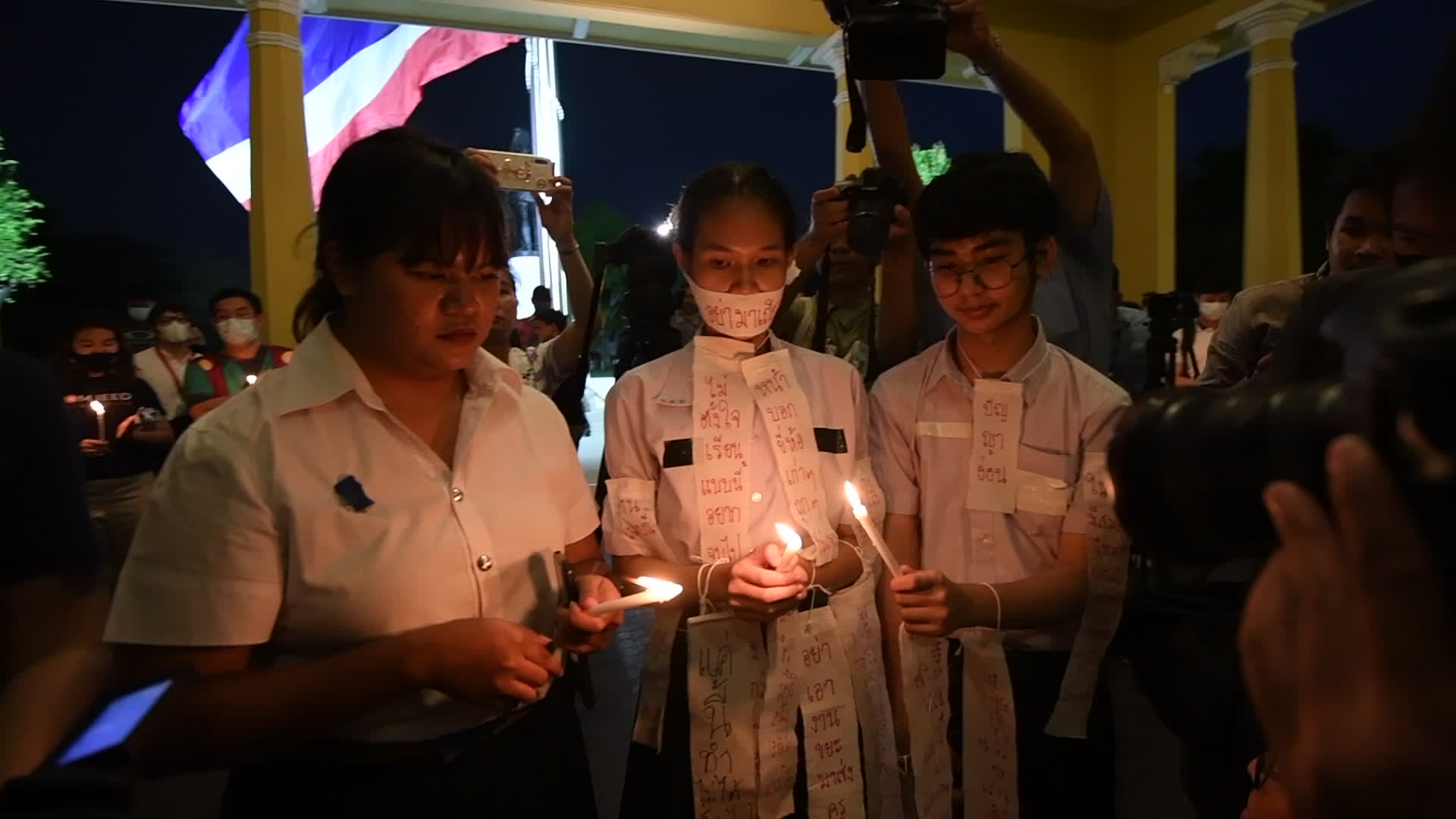 Thai students and teachers light candles against violence in schools