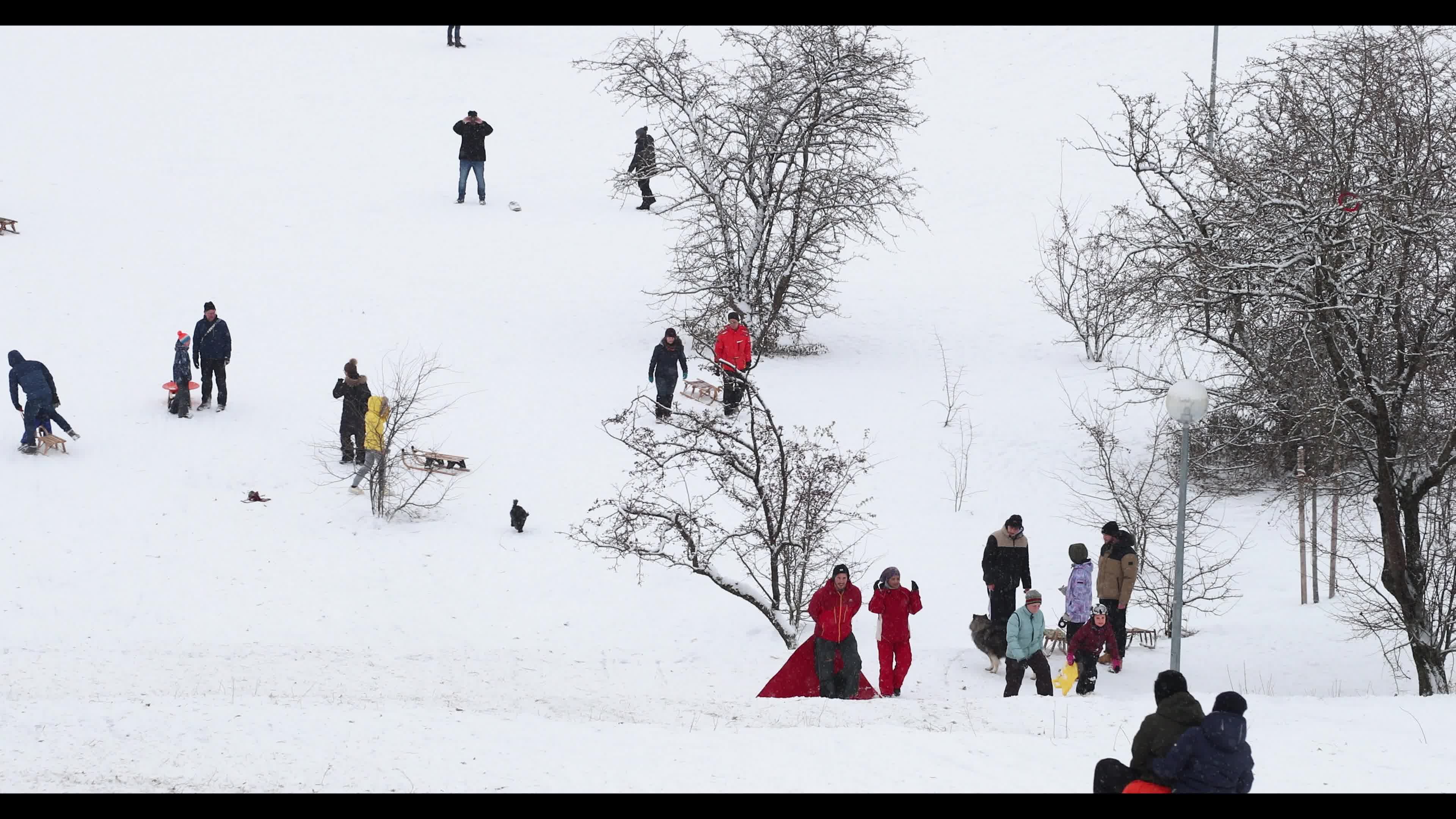 People gather in the Olympic Park in Munich amid the pandemic 
