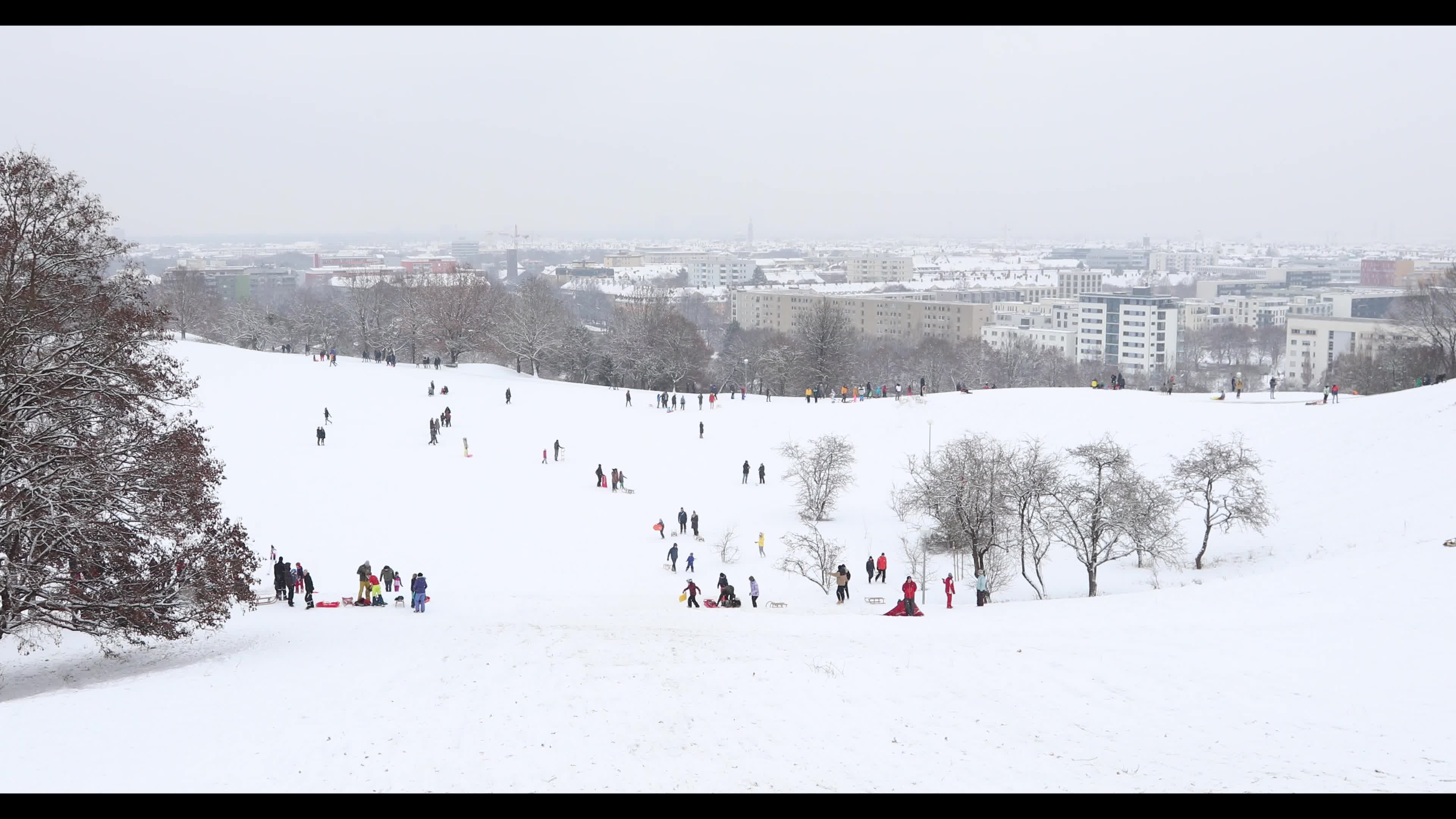 People gather in the Olympic Park in Munich amid the pandemic 