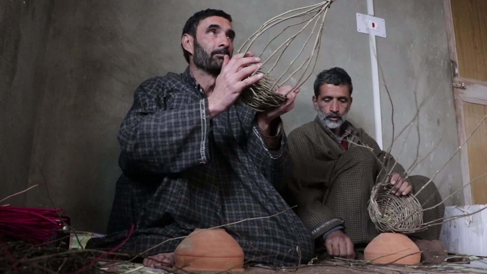 Kashmiri artisan makes Kangri, a traditional fire-pot