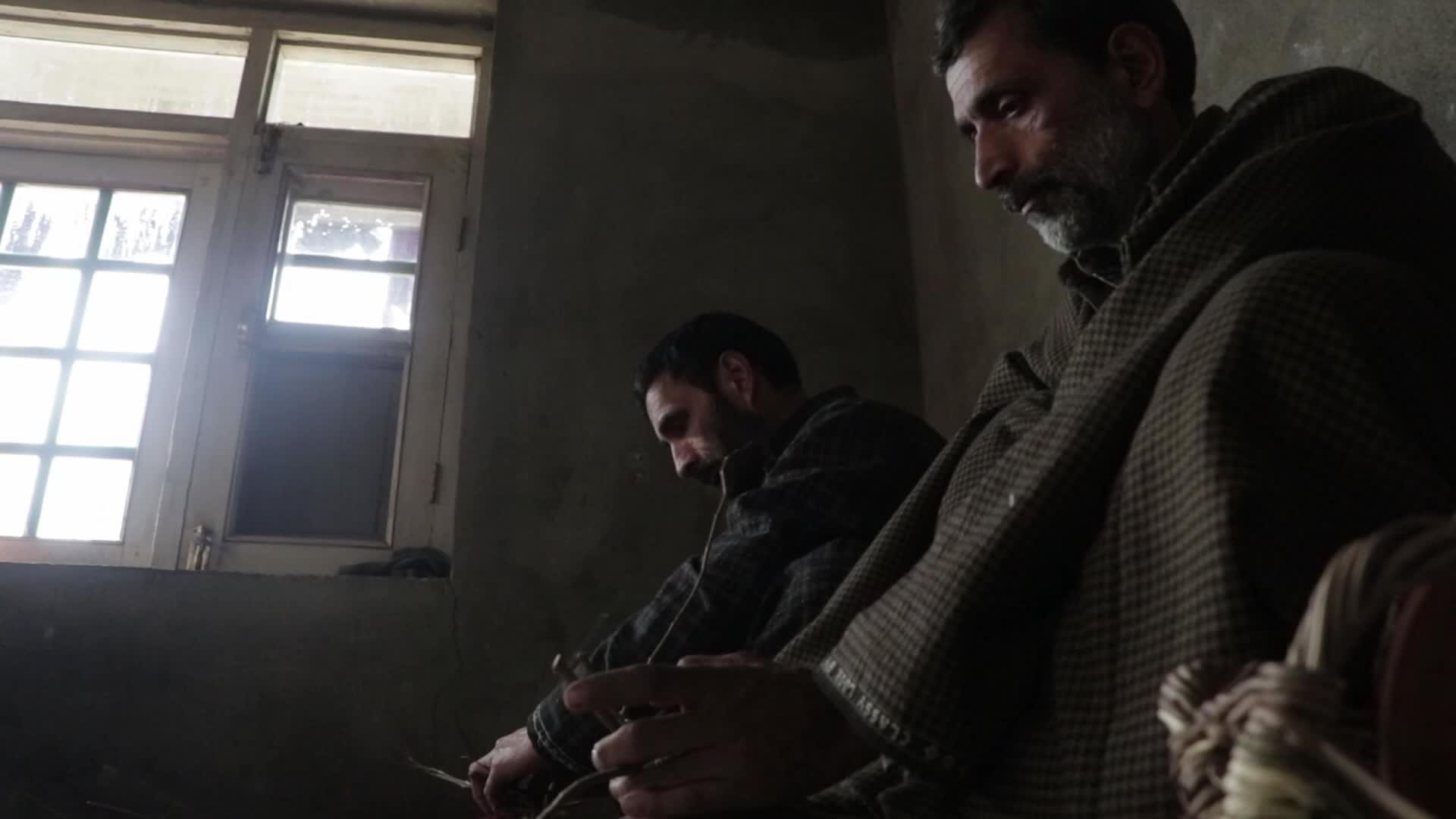 Kashmiri artisan makes Kangri, a traditional fire-pot