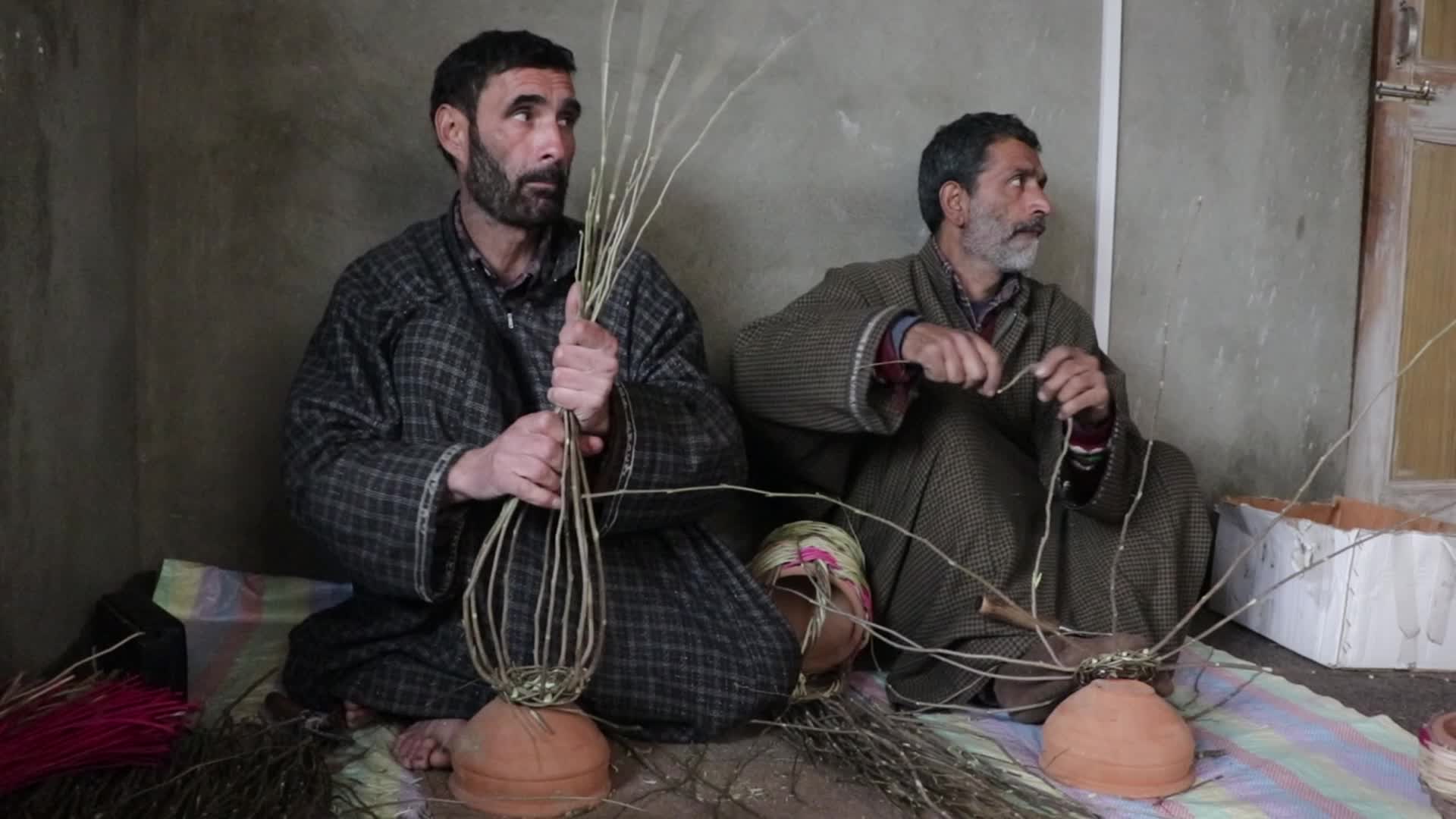 Kashmiri artisan makes Kangri, a traditional fire-pot