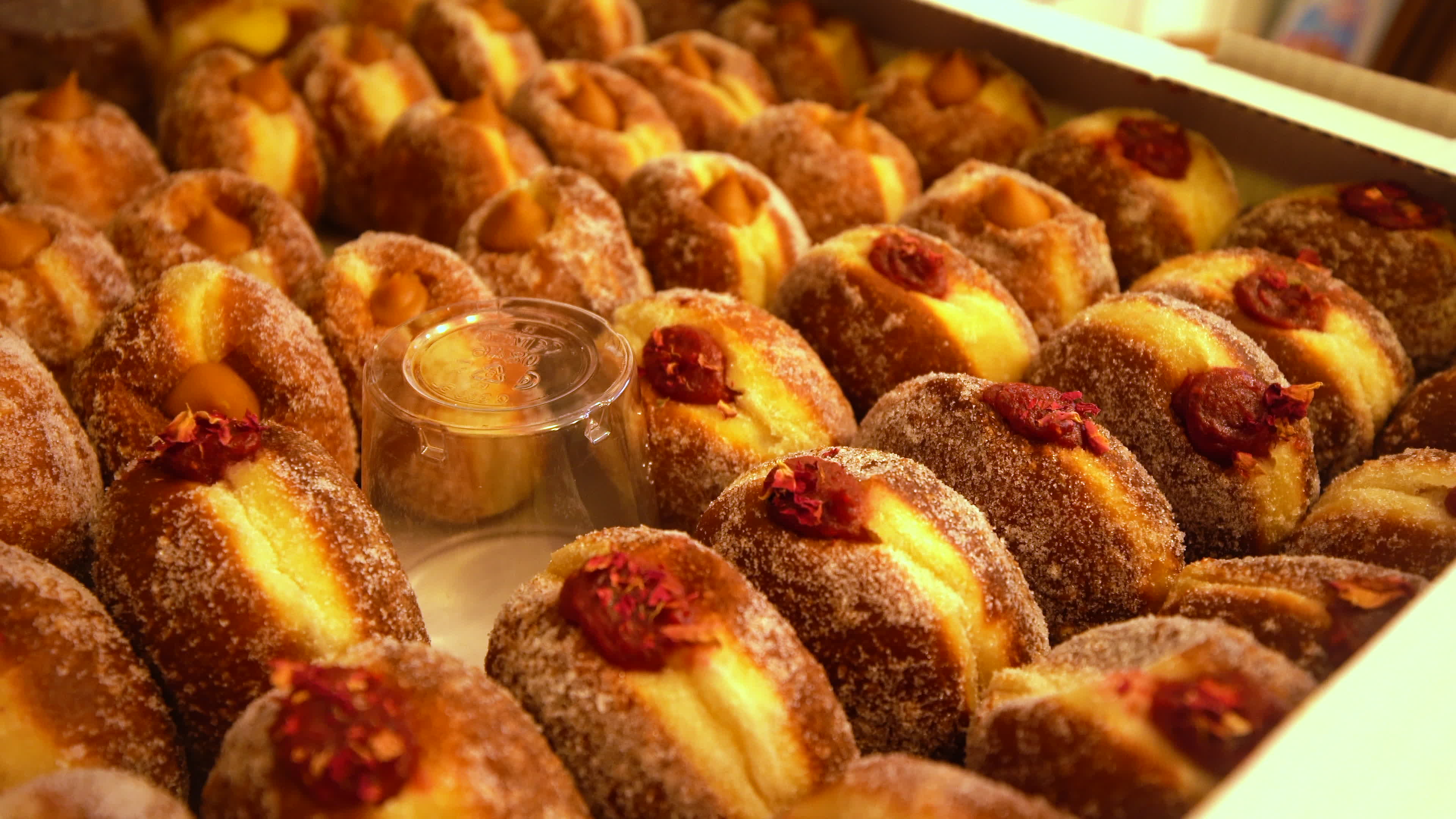 Poles queue in the cold for donuts