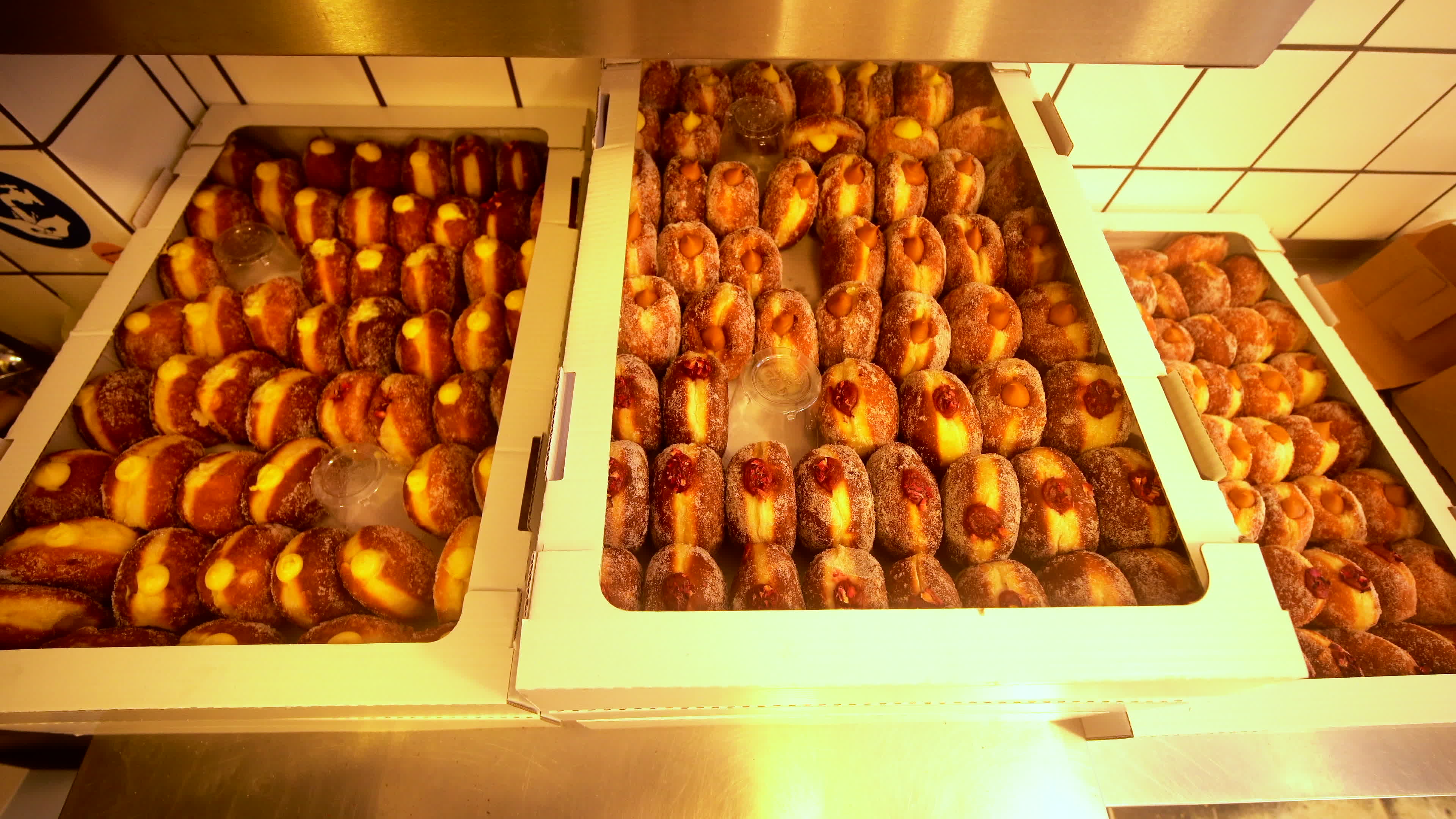 Poles queue in the cold for donuts