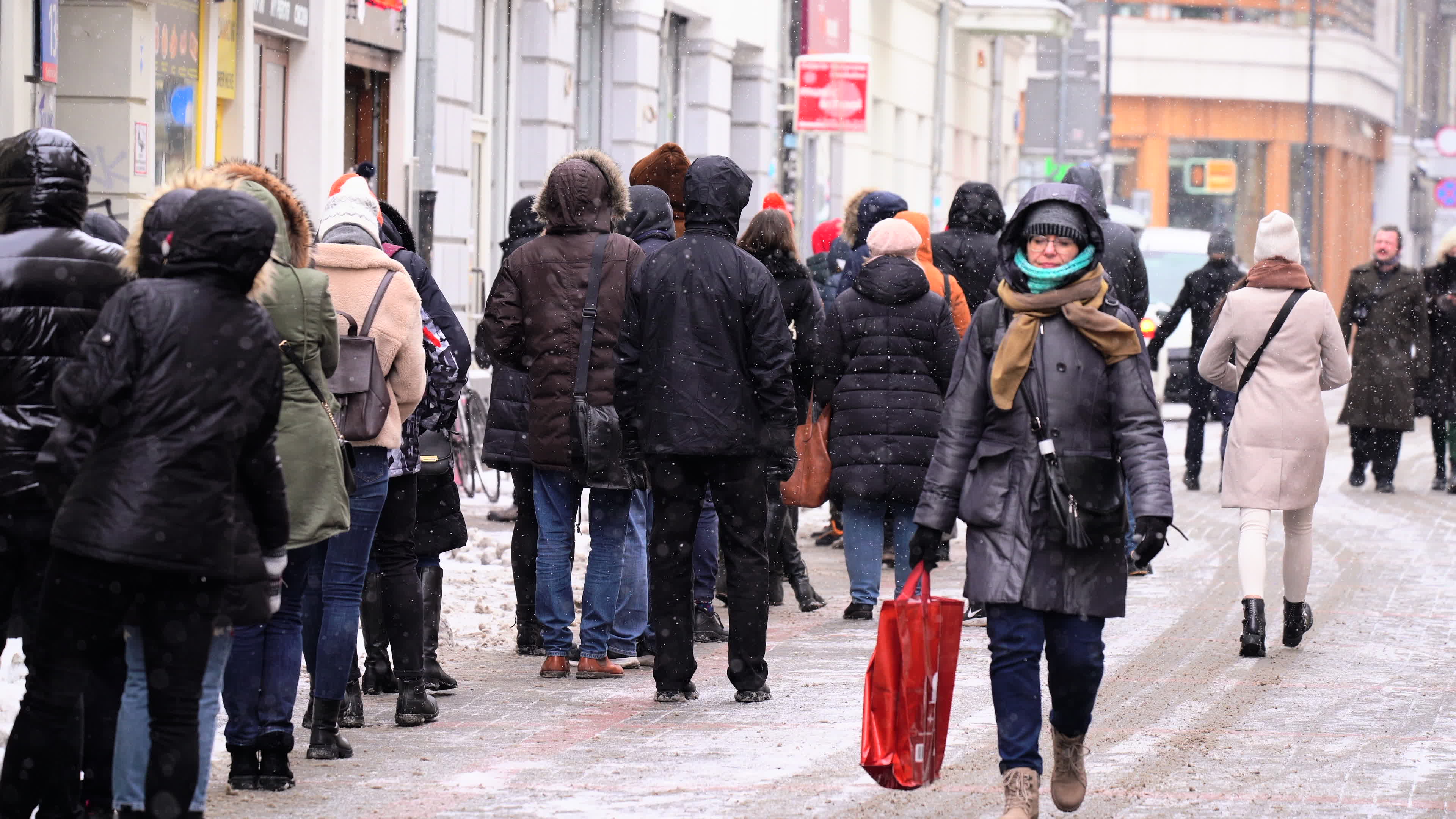 Poles queue in the cold for donuts