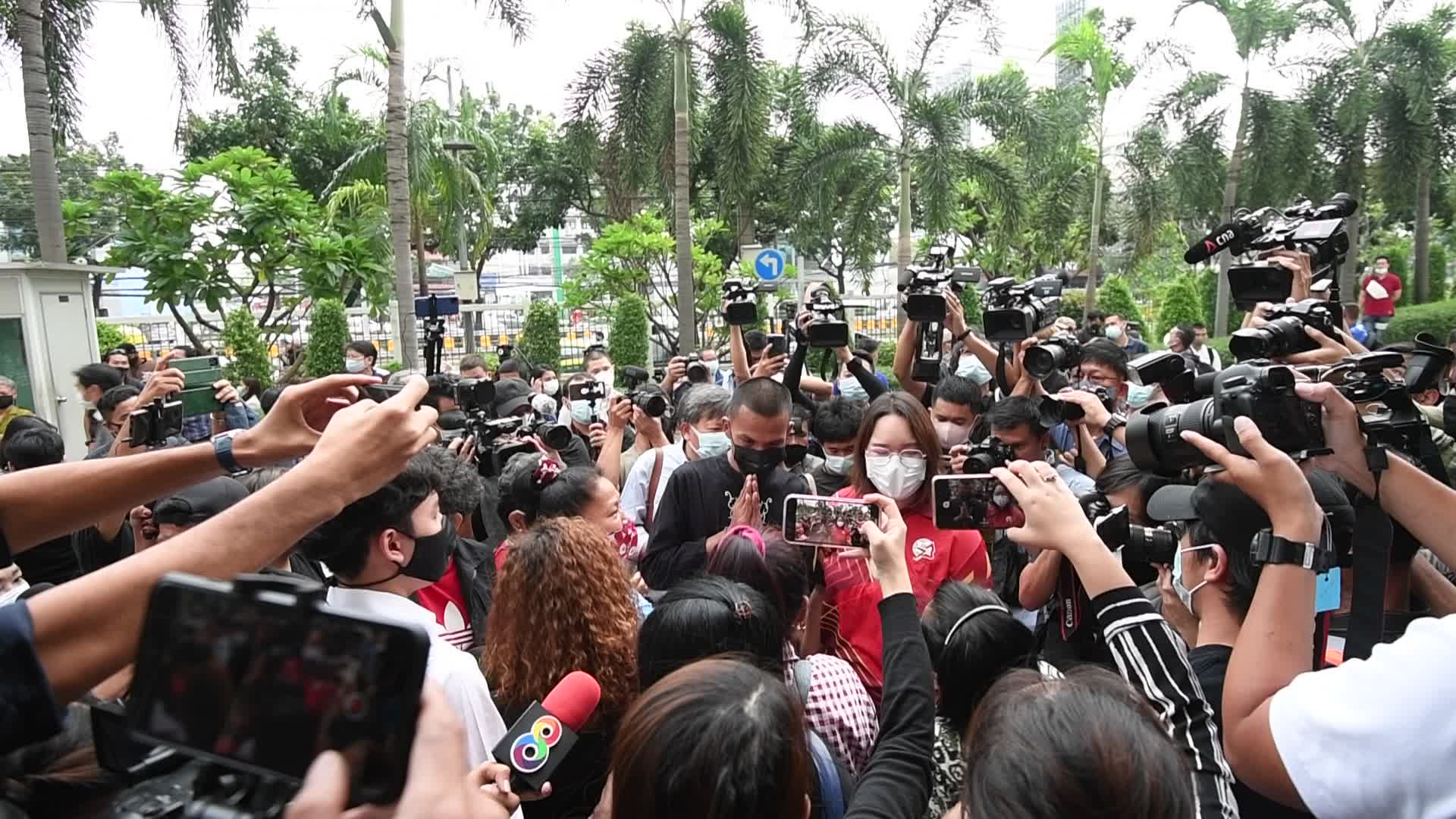 Thai pro-democracy activists report themselves on charges of insulting the royal