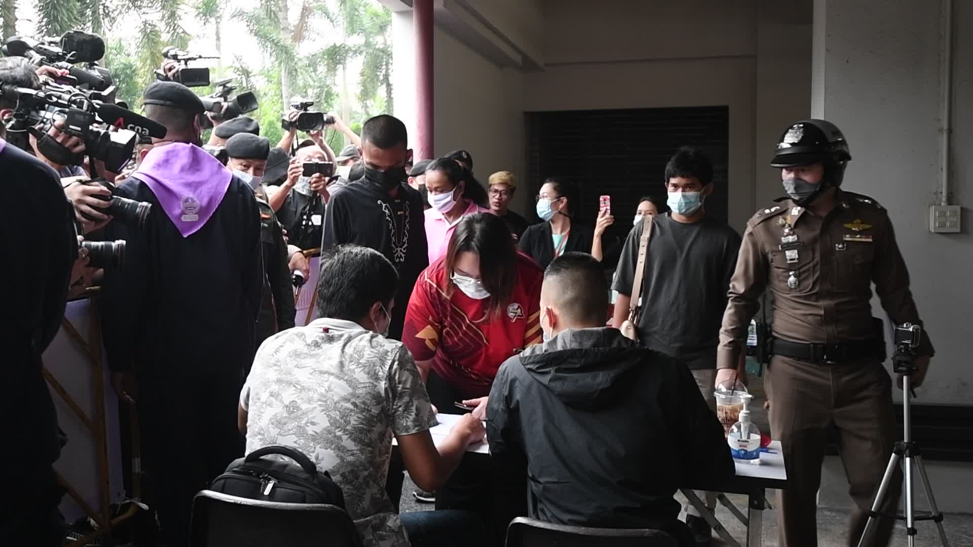 Thai pro-democracy activists report themselves on charges of insulting the royal