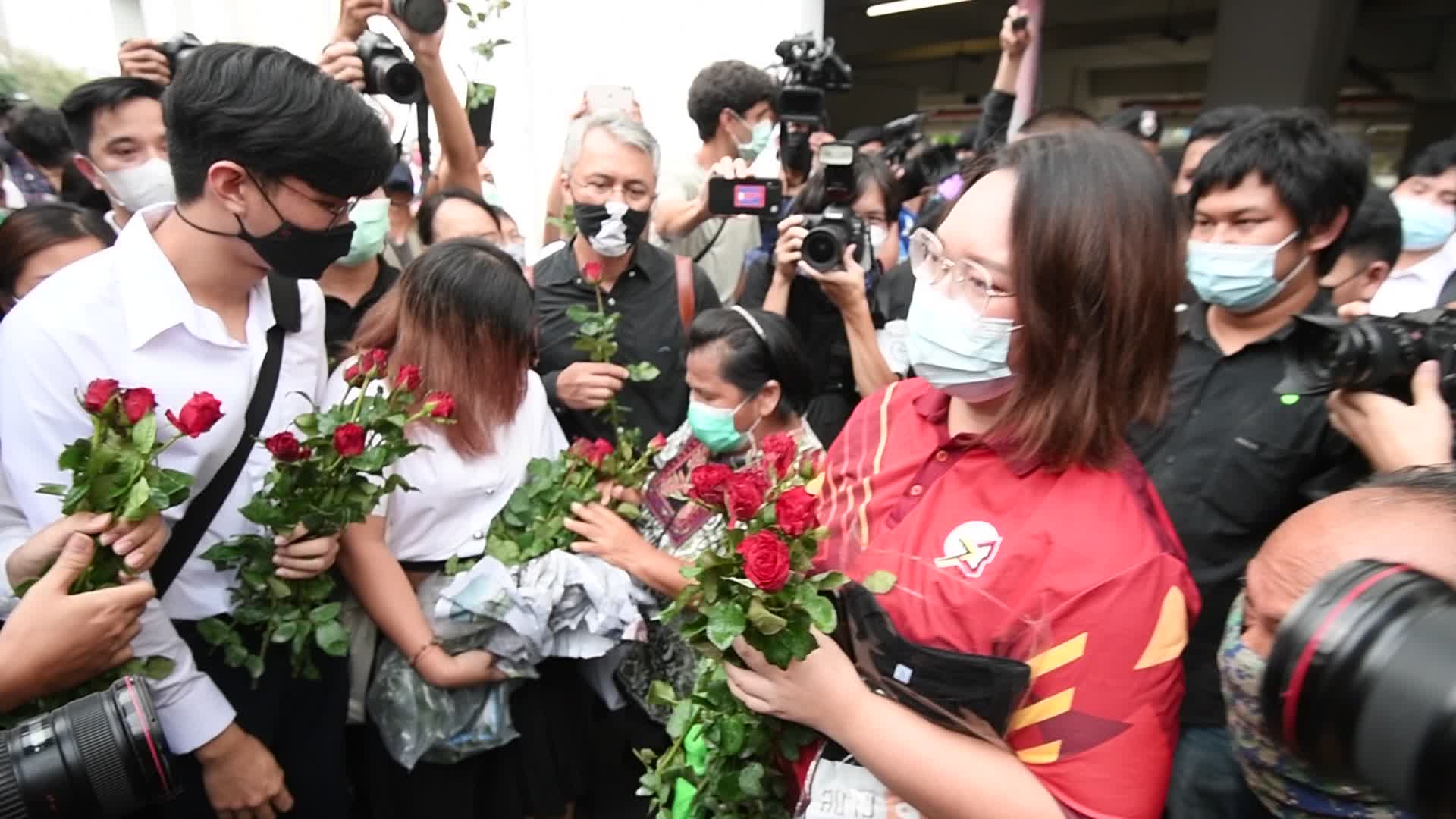 Thai pro-democracy activists report themselves on charges of insulting the royal