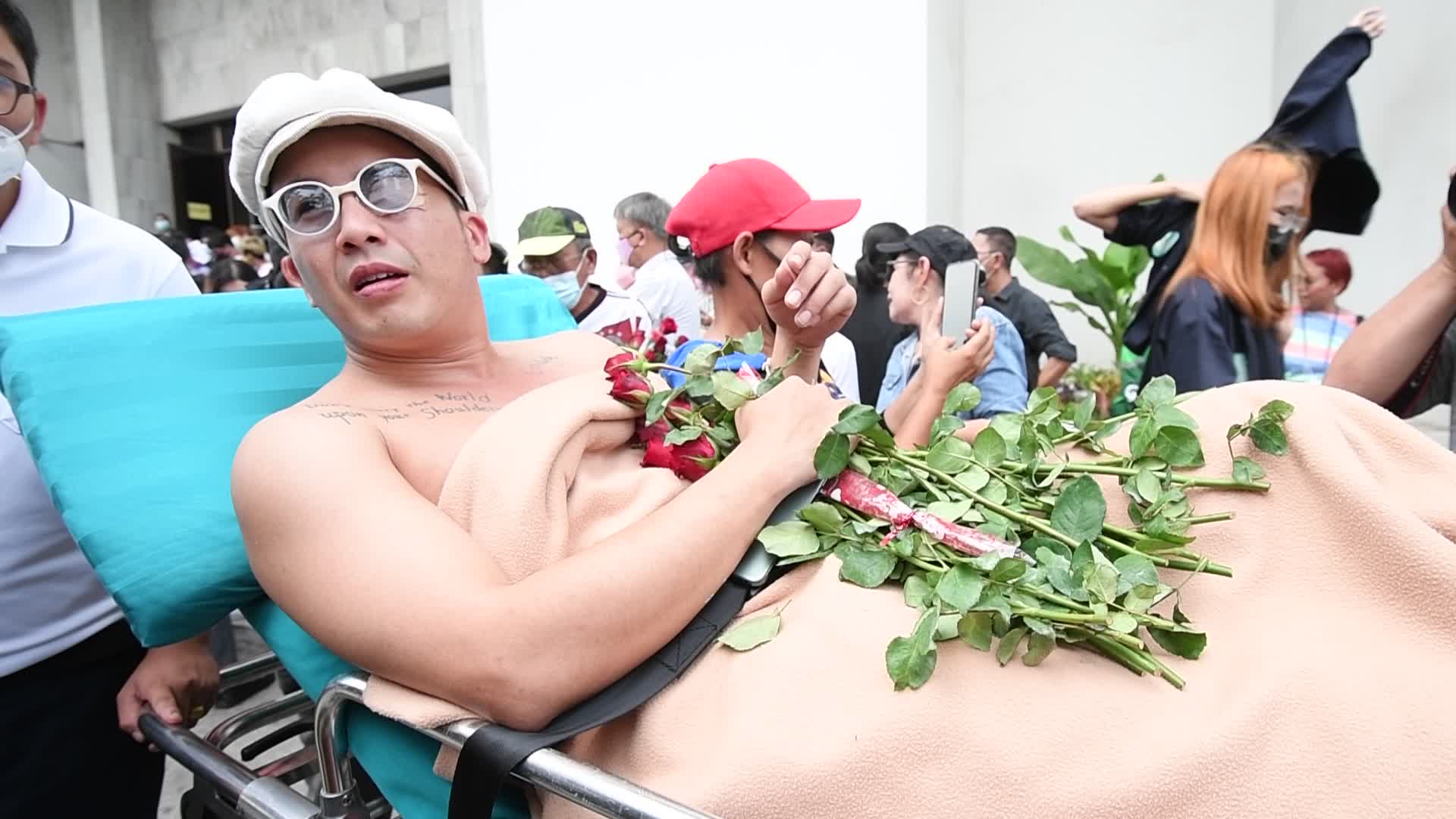 Thai pro-democracy activists report themselves on charges of insulting the royal