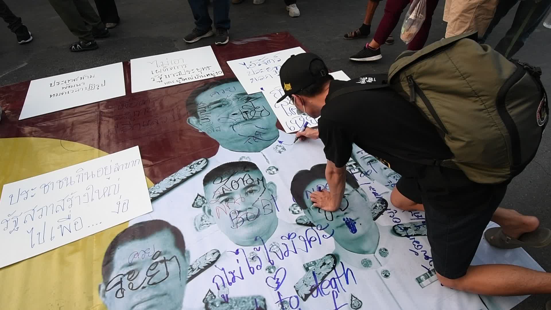 Protest outside the parliament after Thai prime minister survives no-confidence vote