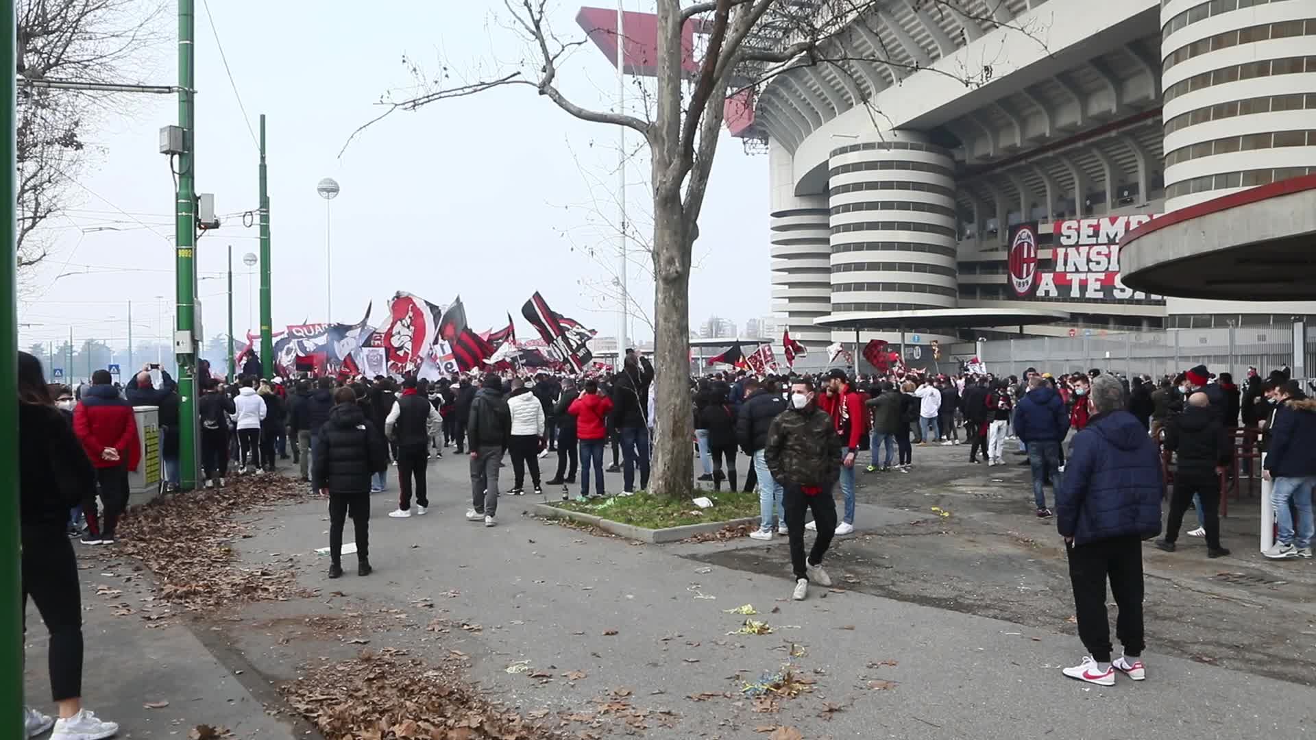 AC Milan and FC Internazionale fans wait for the coaches of the teams outside the San Siro Stadium