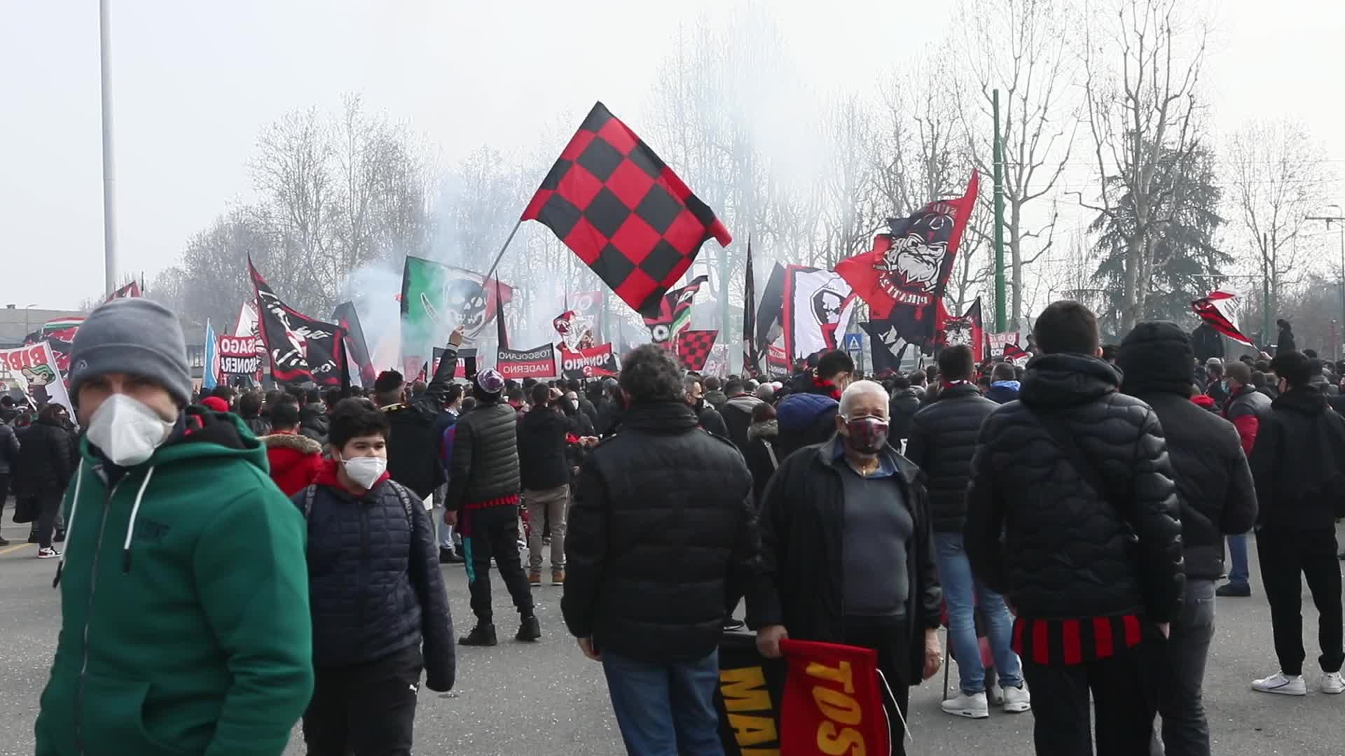AC Milan and FC Internazionale fans wait for the coaches of the teams outside the San Siro Stadium