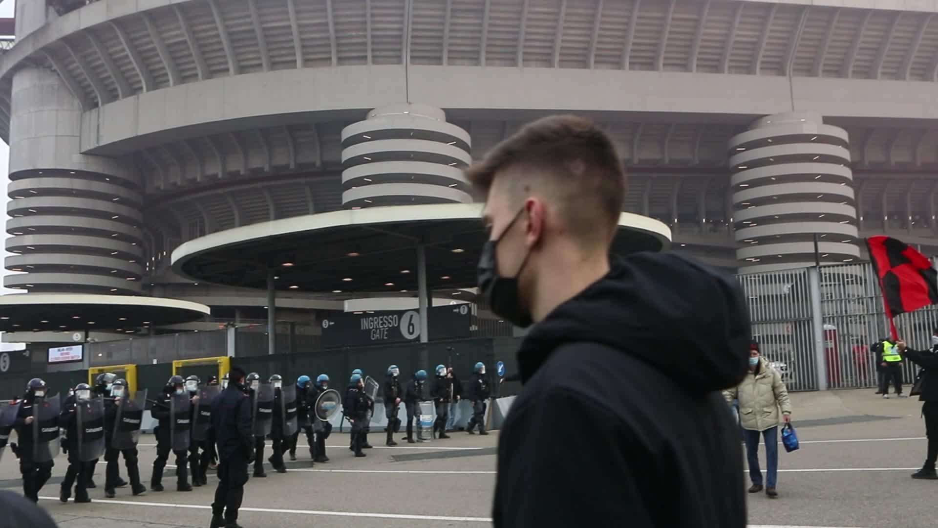 AC Milan and FC Internazionale fans wait for the coaches of the teams outside the San Siro Stadium
