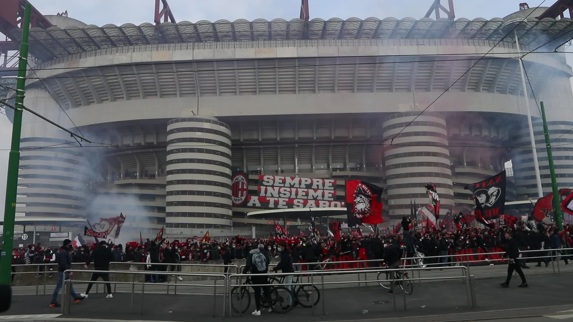 AC Milan and FC Internazionale fans wait for the coaches of the teams outside the San Siro Stadium