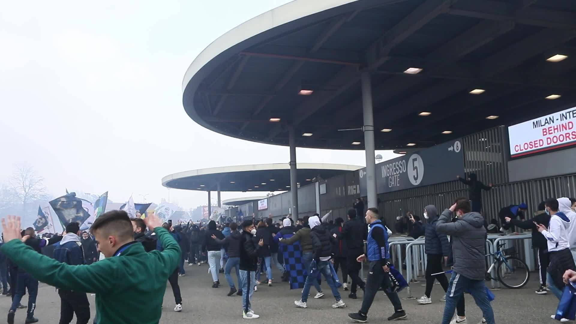 AC Milan and FC Internazionale fans wait for the coaches of the teams outside the San Siro Stadium