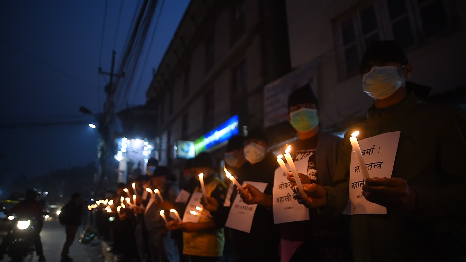 Human Rights activists hold candle light to protest against Myanmar Military Coup