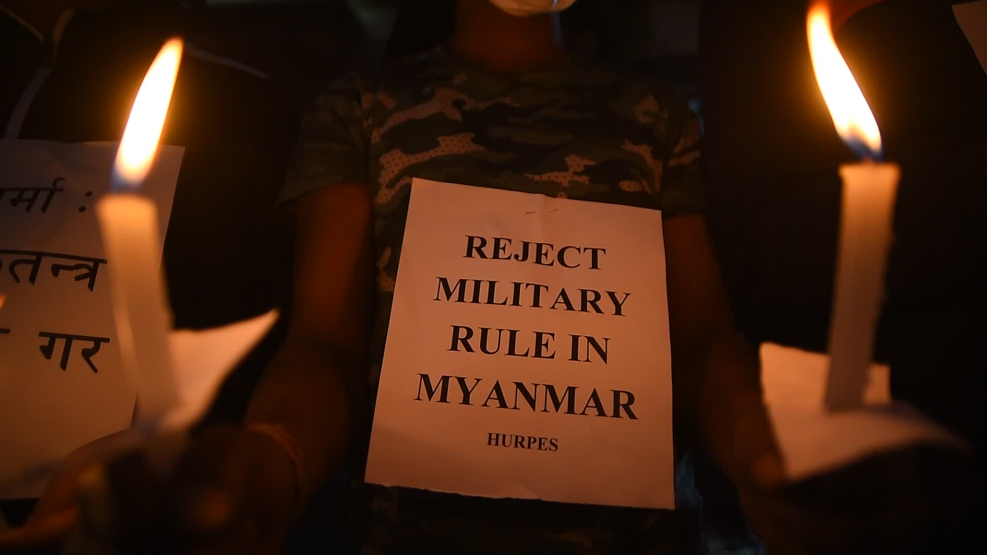 Human Rights activists hold candle light to protest against Myanmar Military Coup