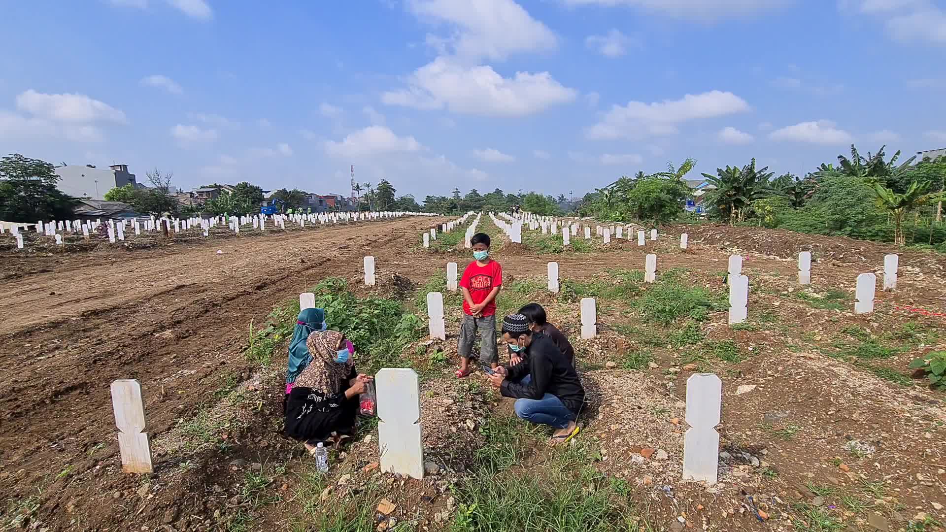 People visits a Covid-19 graveyard in Indonesia