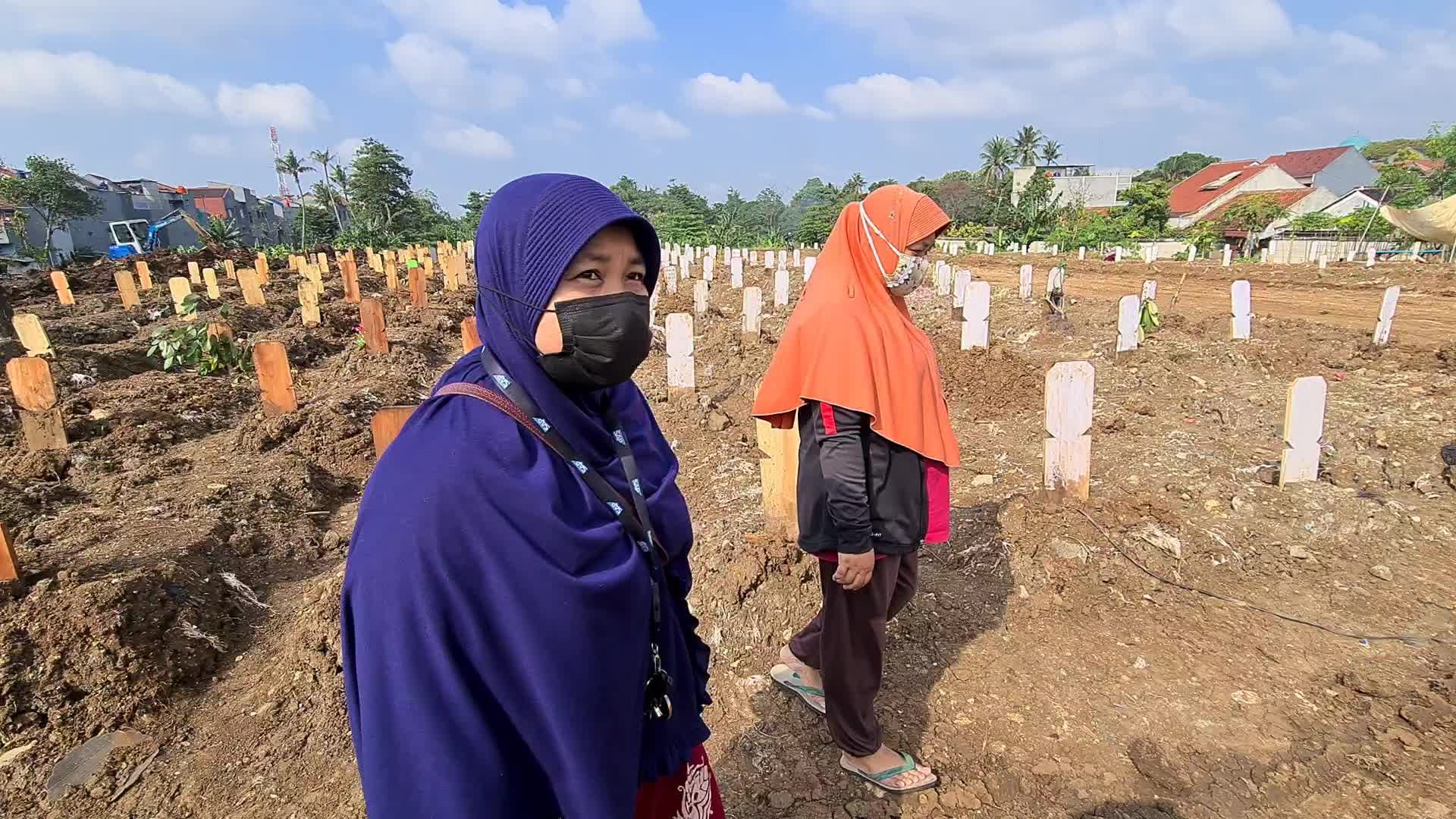 People visits a Covid-19 graveyard in Indonesia