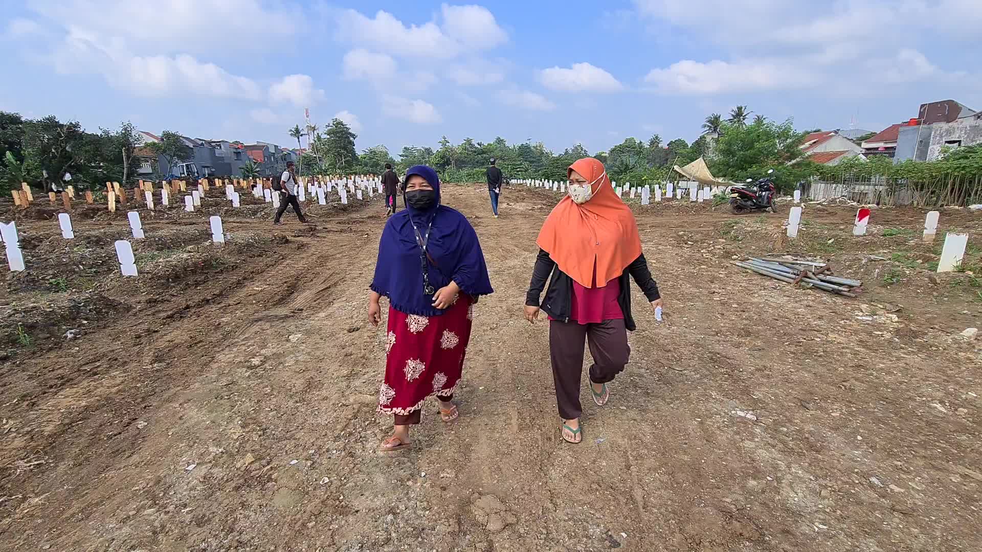 People visits a Covid-19 graveyard in Indonesia
